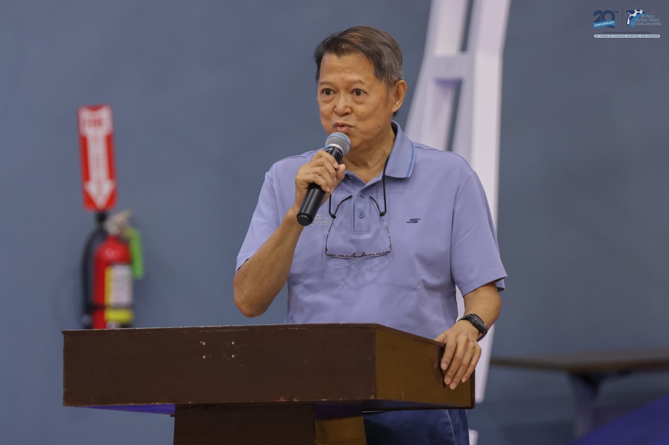 May be an image of 1 person, dais and text