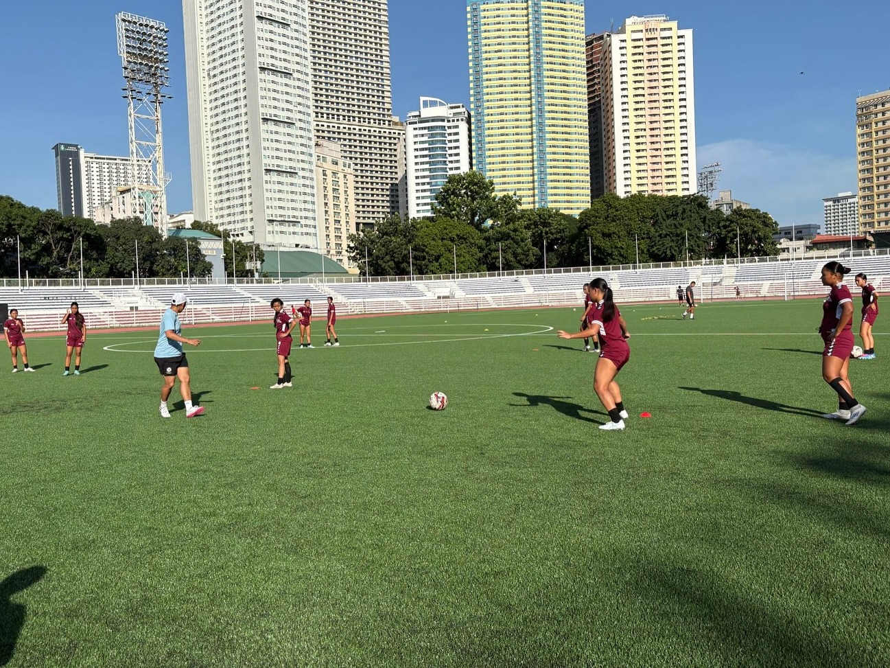May be an image of 10 people, people playing football, people playing soccer, grass and text