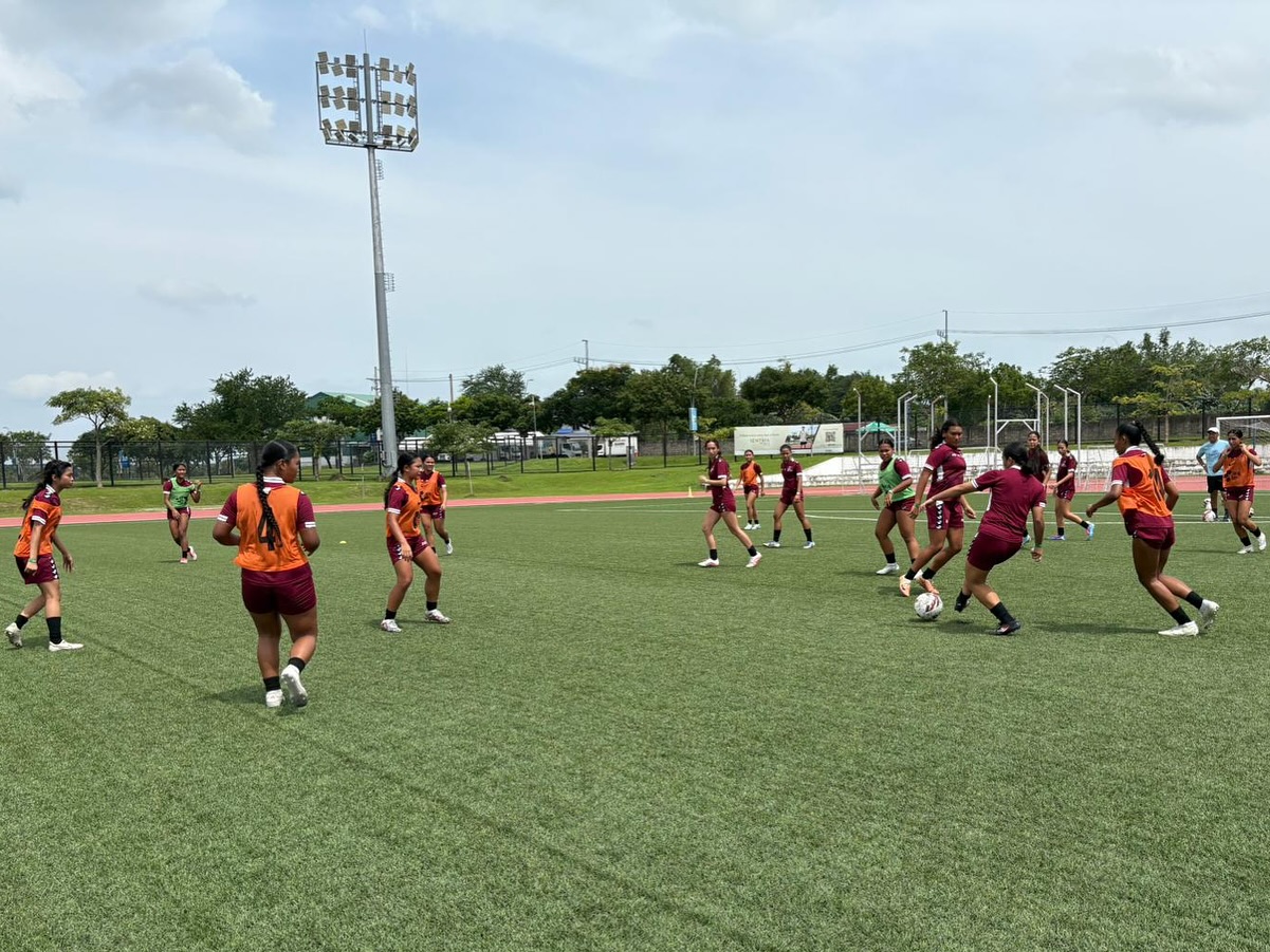 May be an image of 13 people, people playing football and people playing soccer