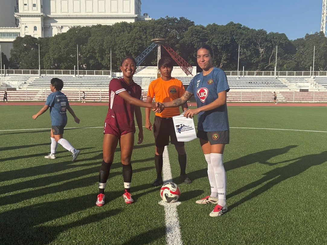 May be an image of 4 people, people playing football, people playing soccer, grass and text