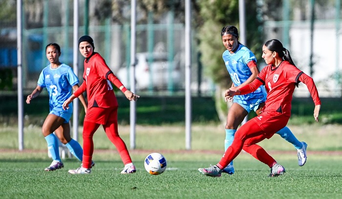 May be an image of 4 people, people playing soccer and people playing football