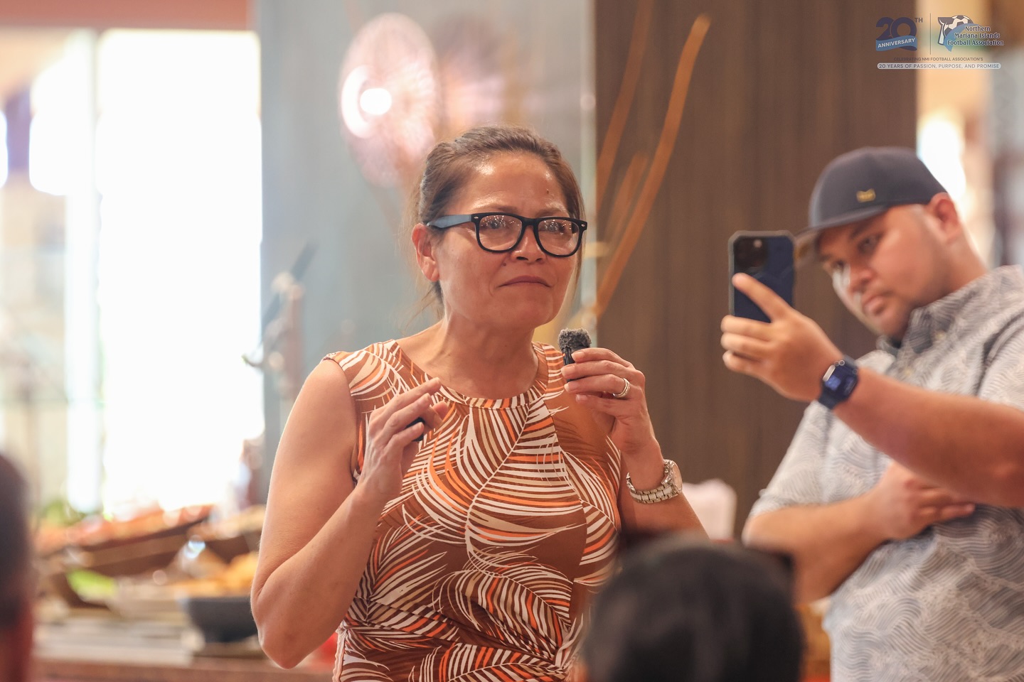 May be an image of 2 people, sushi, phone, eyewear and text