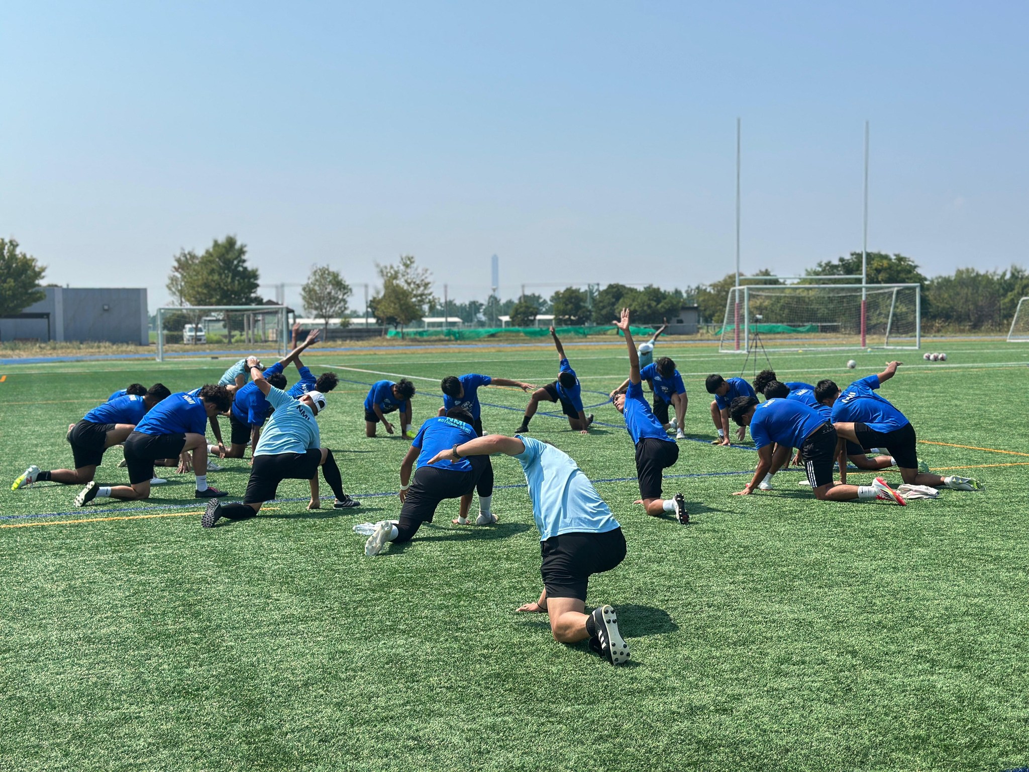 May be an image of 10 people, people playing football, people playing soccer and grass
