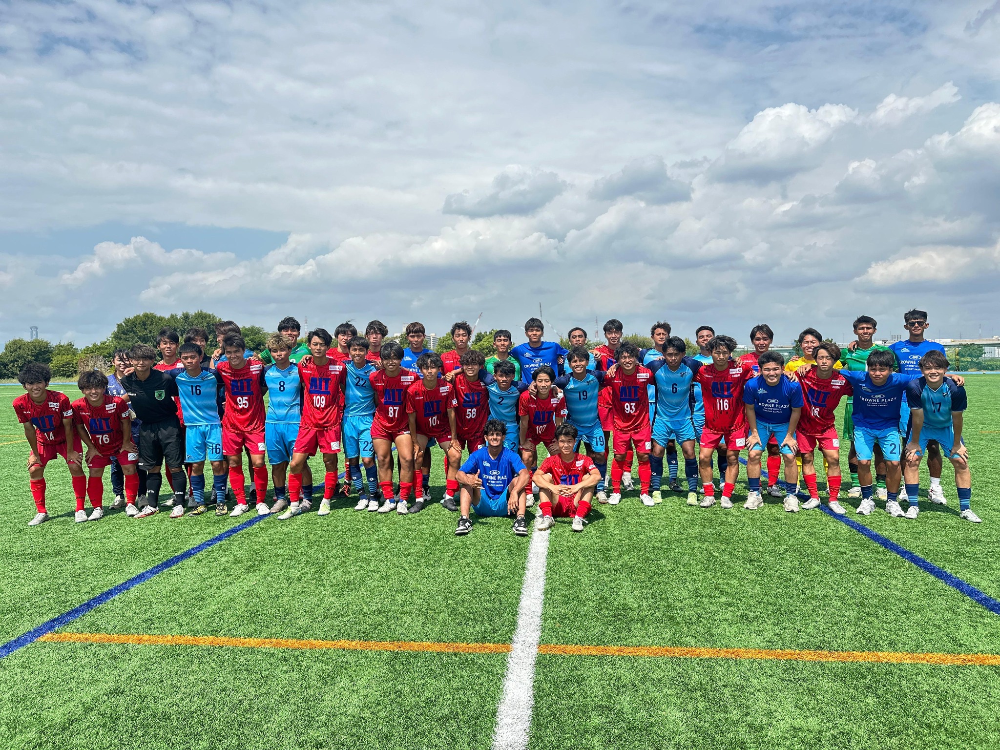 May be an image of 2 people, people playing football, people playing soccer, grass and text