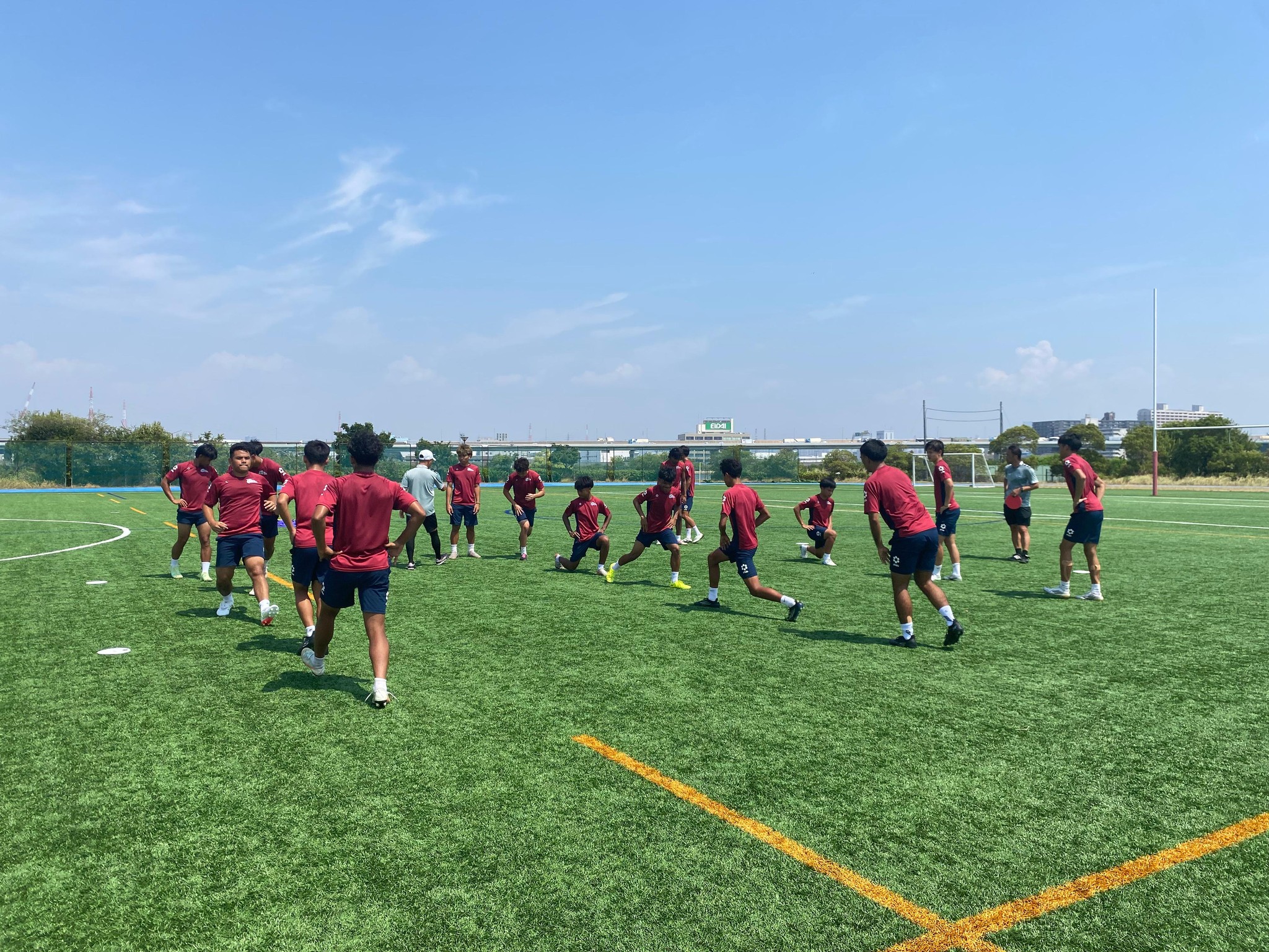 May be an image of 7 people, people playing football, people playing soccer, grass and text