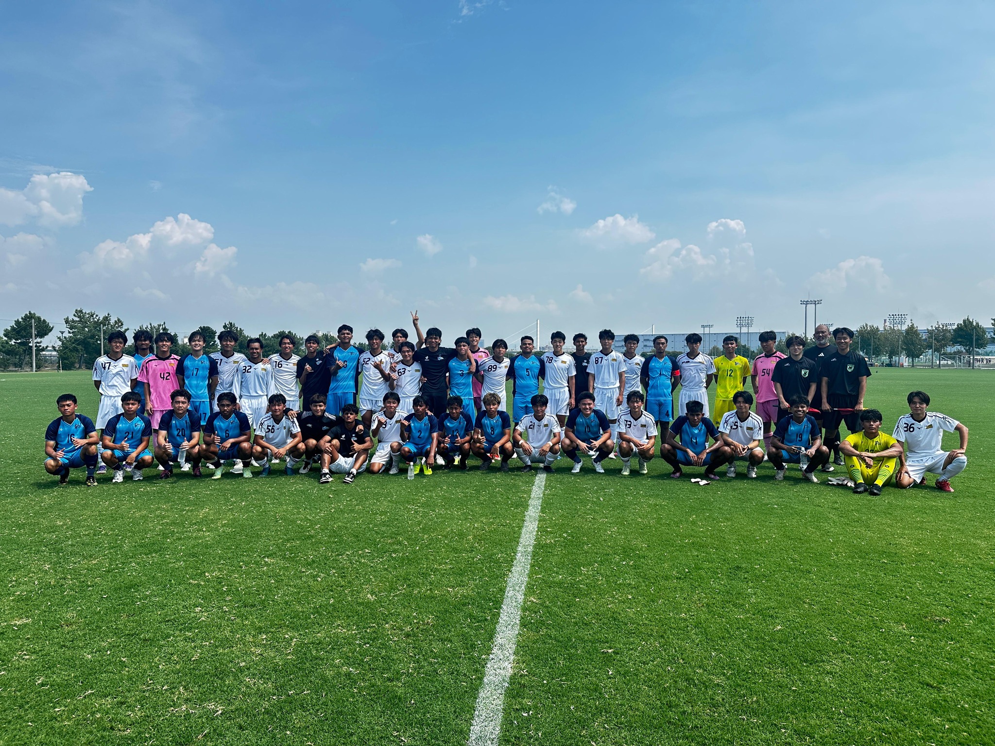 May be an image of 2 people, people playing soccer, people playing football and grass