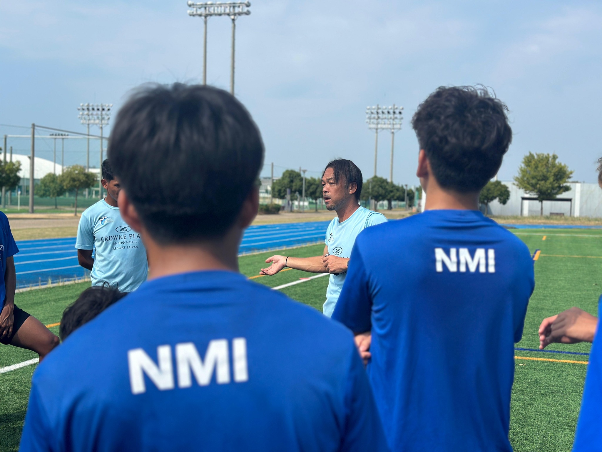 May be an image of 5 people, people playing football, people playing soccer and text