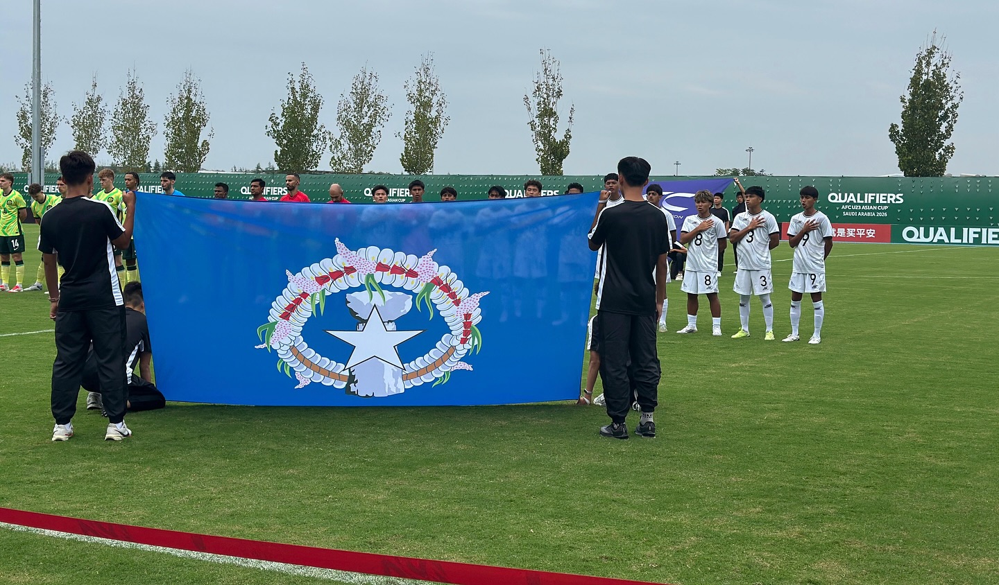 May be an image of 8 people, people playing football, people playing soccer and text