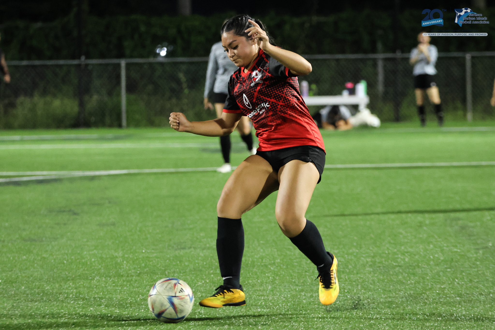 May be an image of 2 people, people playing football, people playing soccer and text