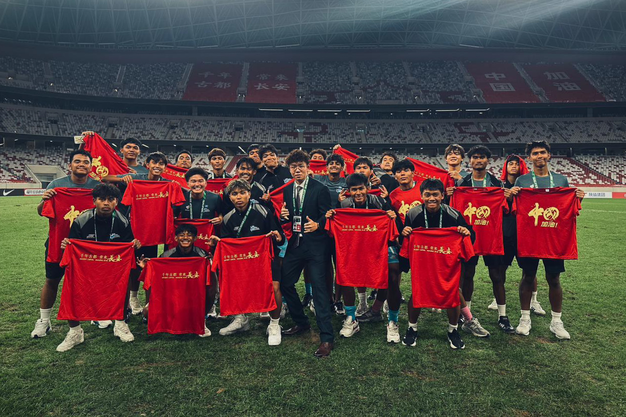 May be an image of 4 people, people playing football, people playing soccer and text