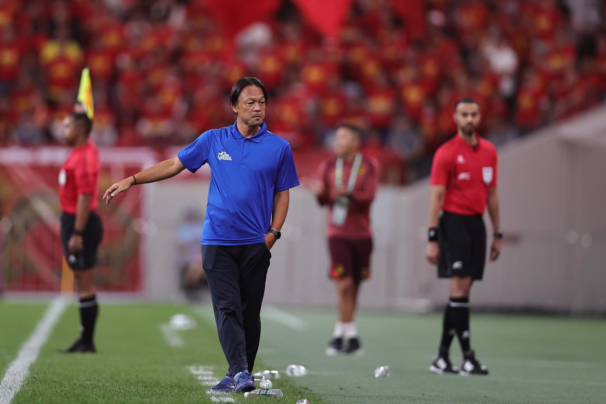 May be an image of 4 people, people playing football, people playing soccer and text