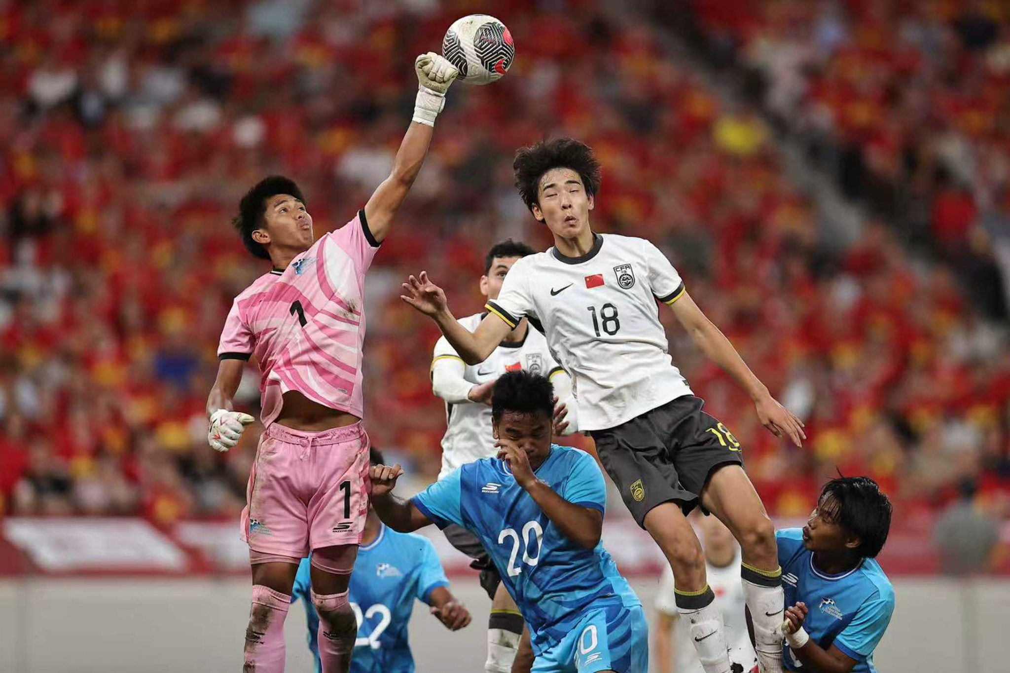 May be an image of 4 people, people playing football, people playing soccer and text