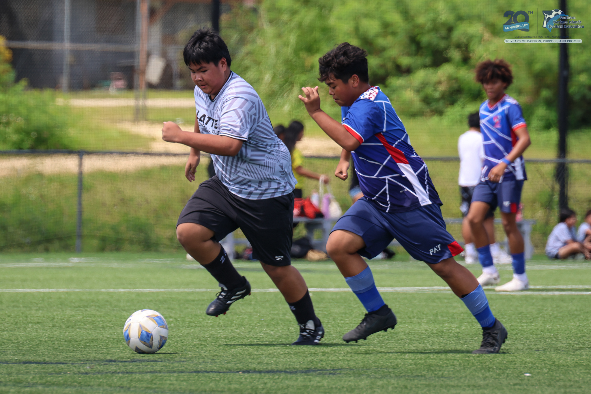 May be an image of 4 people, people playing football, people playing soccer and text
