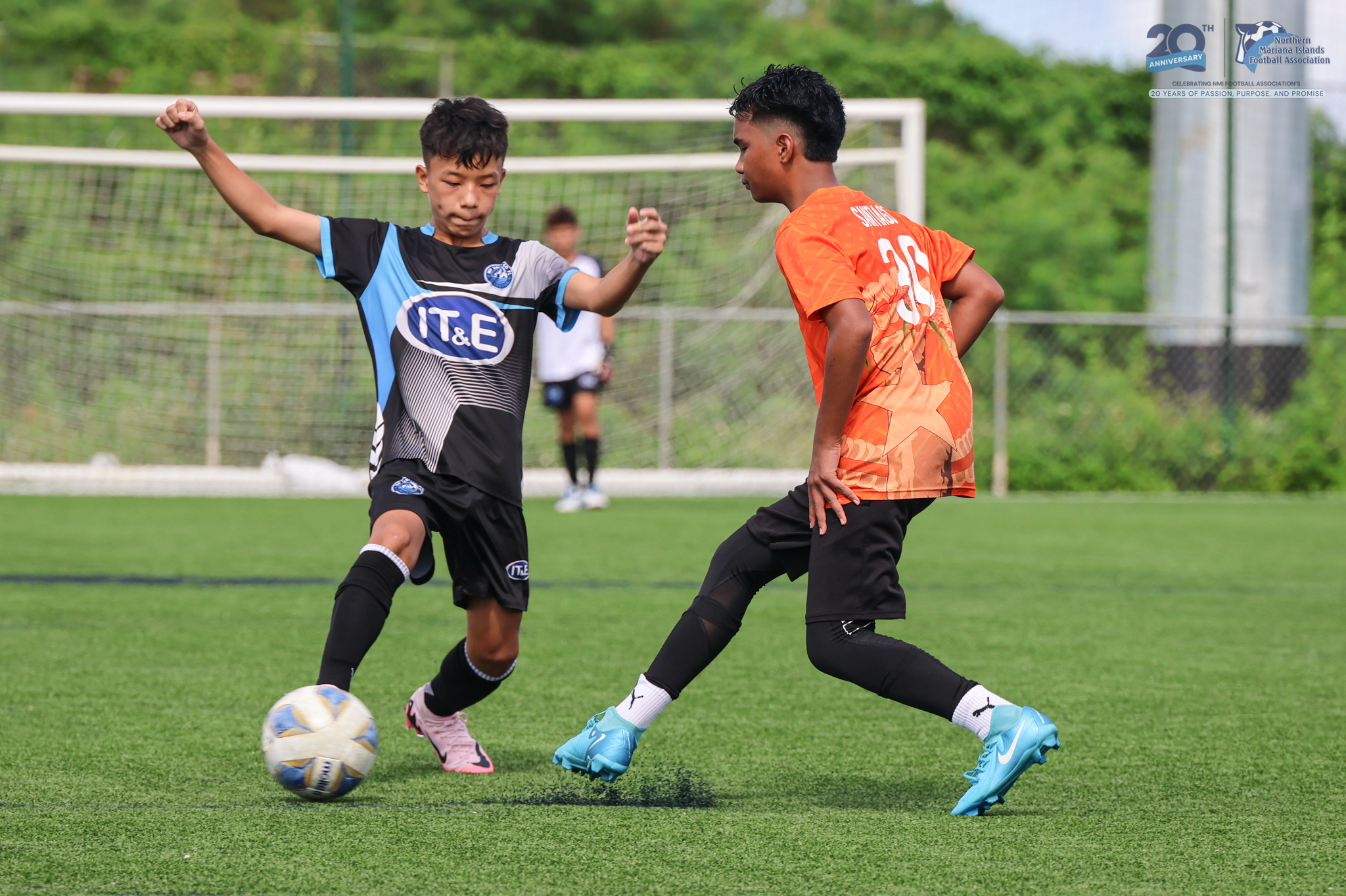 May be an image of 2 people, people playing football, people playing soccer and text