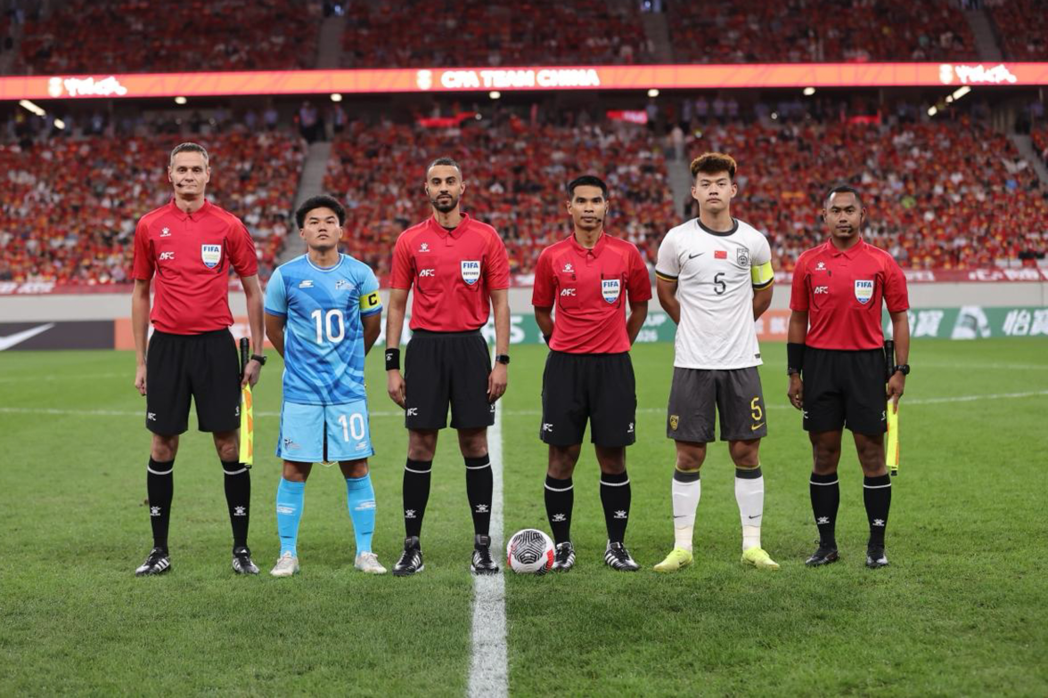 May be an image of 6 people, people playing football, people playing soccer and text