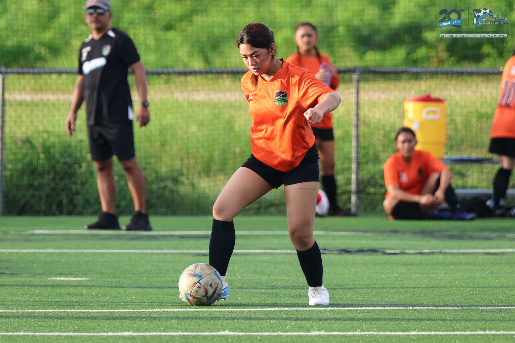 May be an image of 4 people, people playing football, people playing soccer and text
