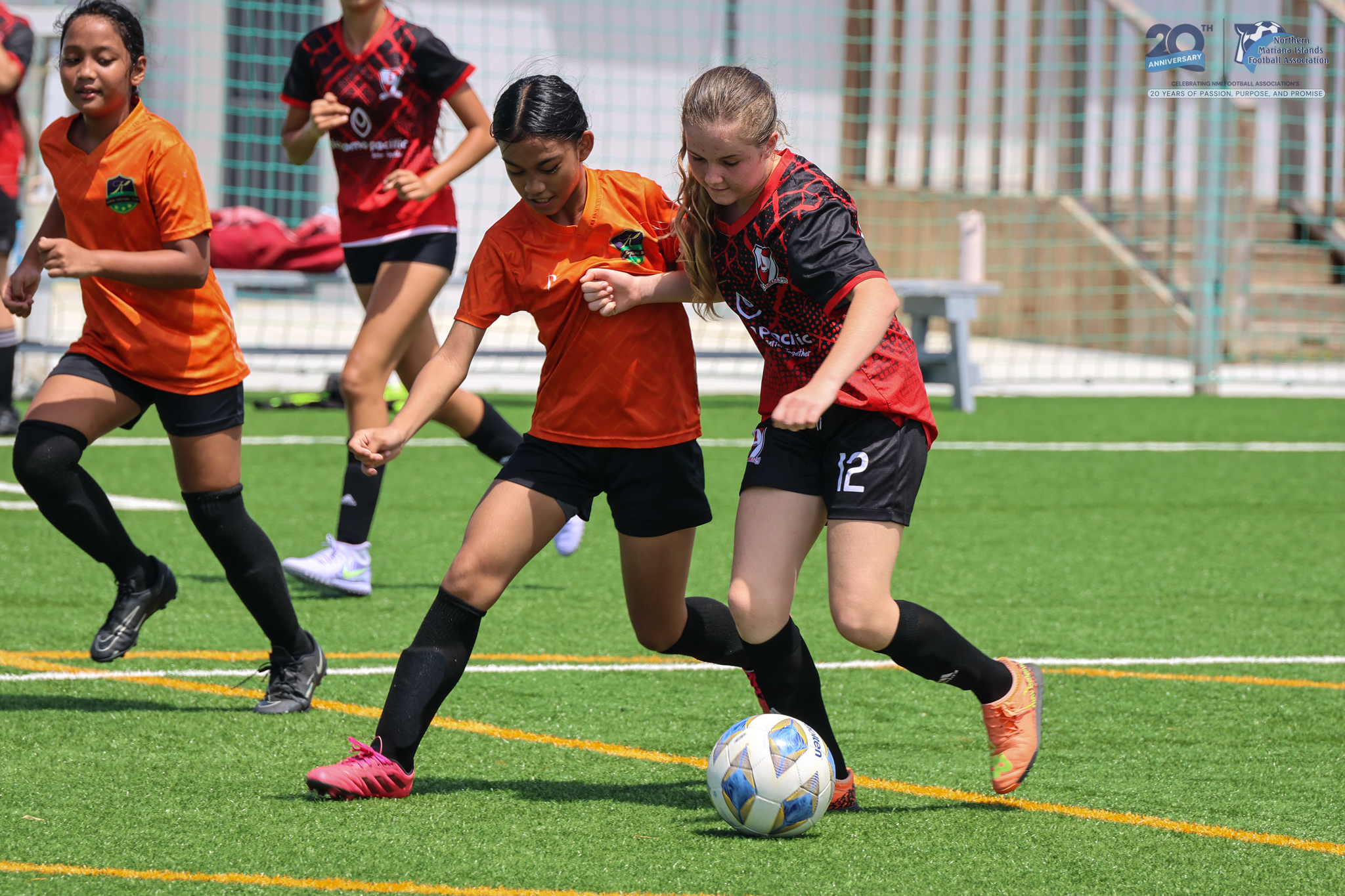 May be an image of 4 people, people playing football, people playing soccer and text