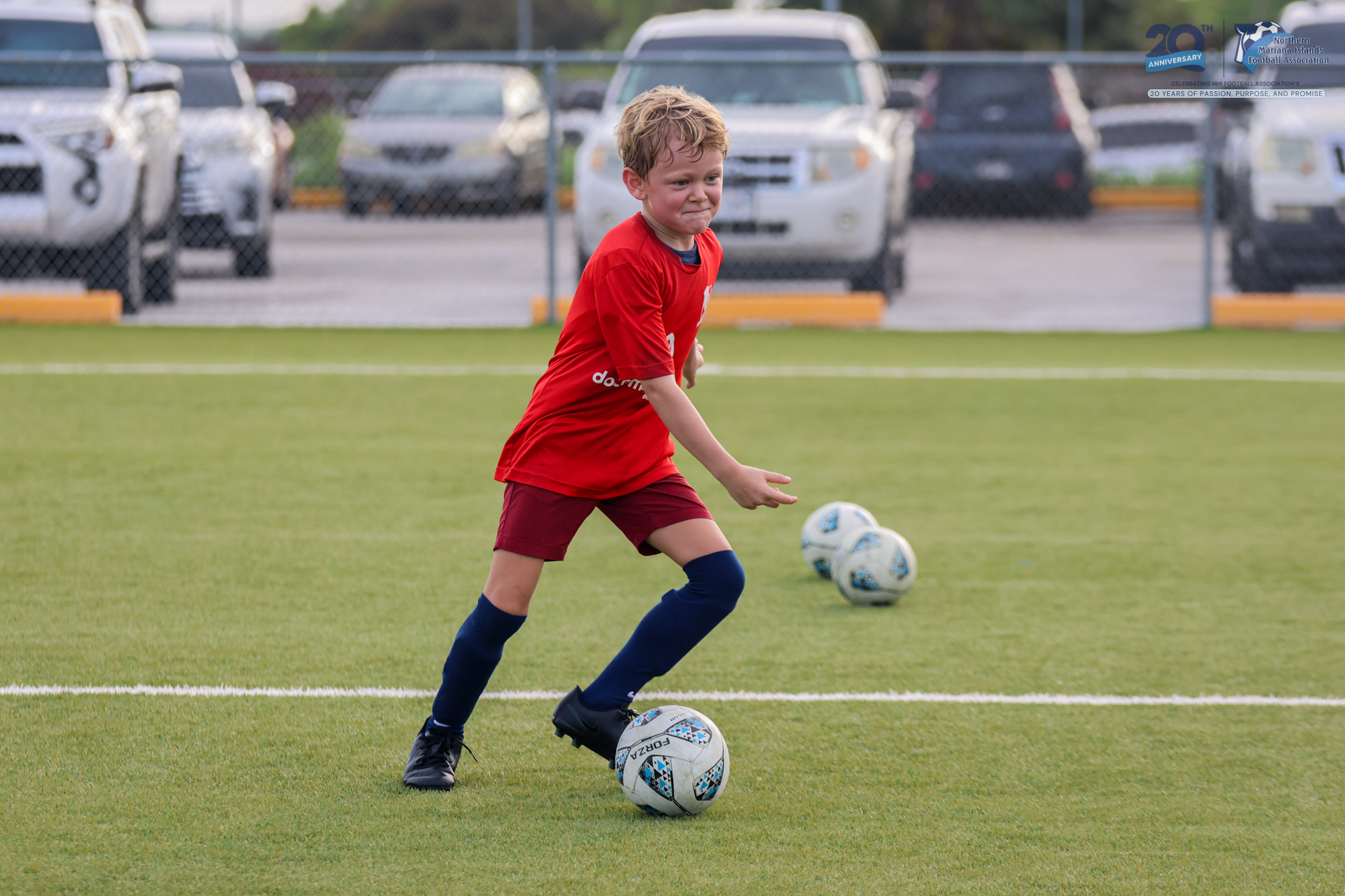 May be an image of 1 person, playing football, playing soccer and text