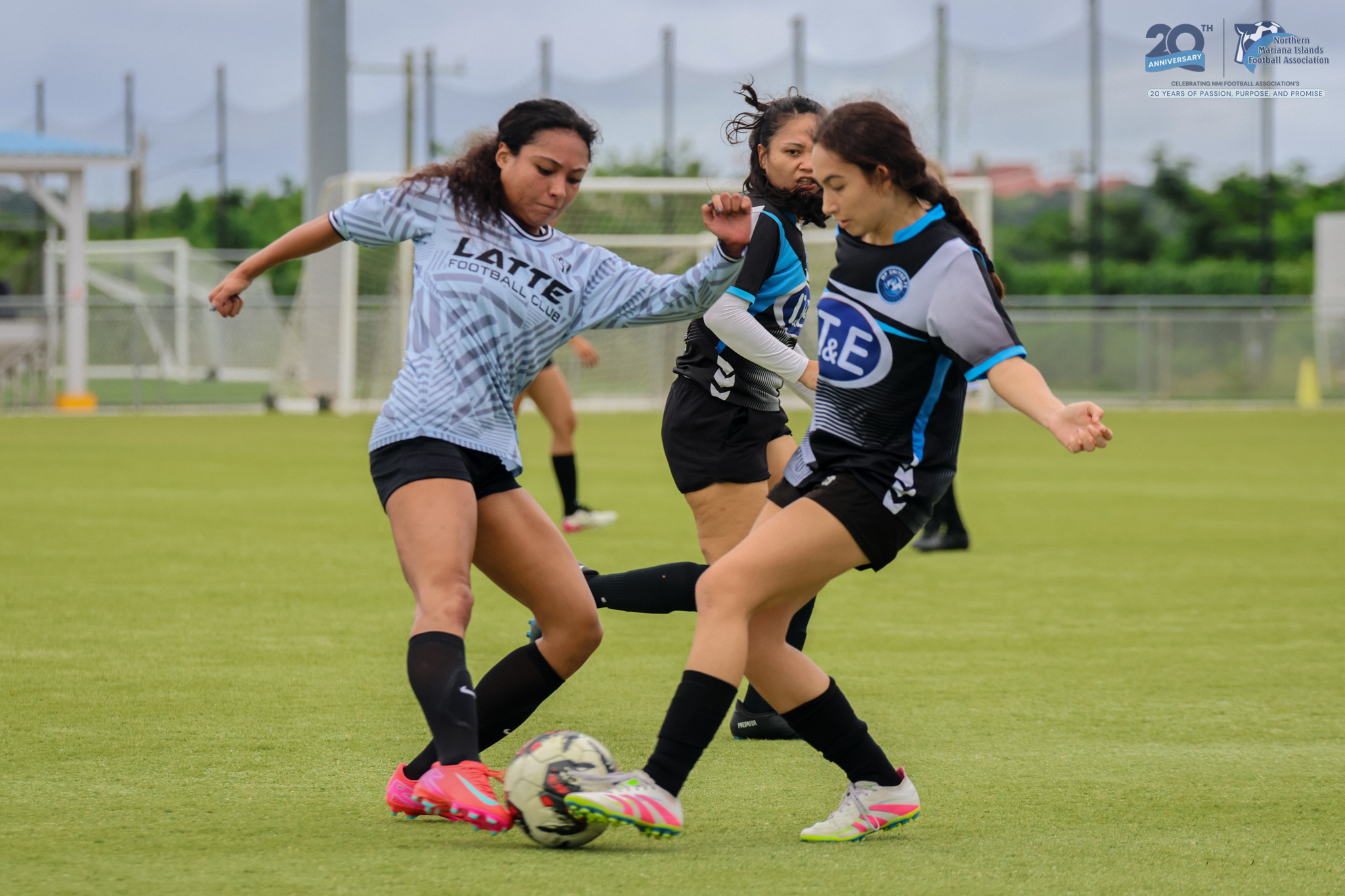 May be an image of 2 people, people playing football, people playing soccer and text