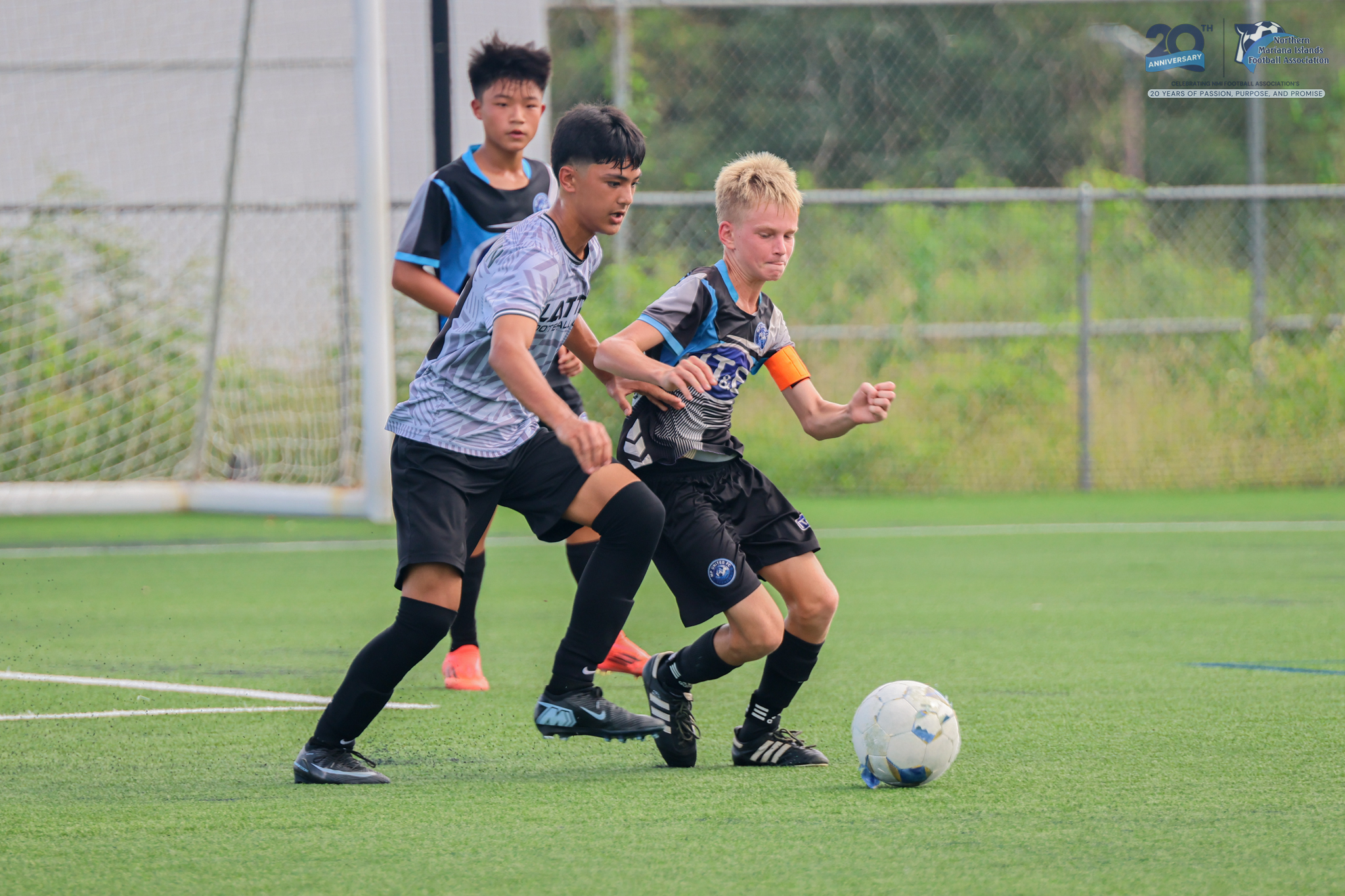 May be an image of 2 people, people playing football, people playing soccer and text