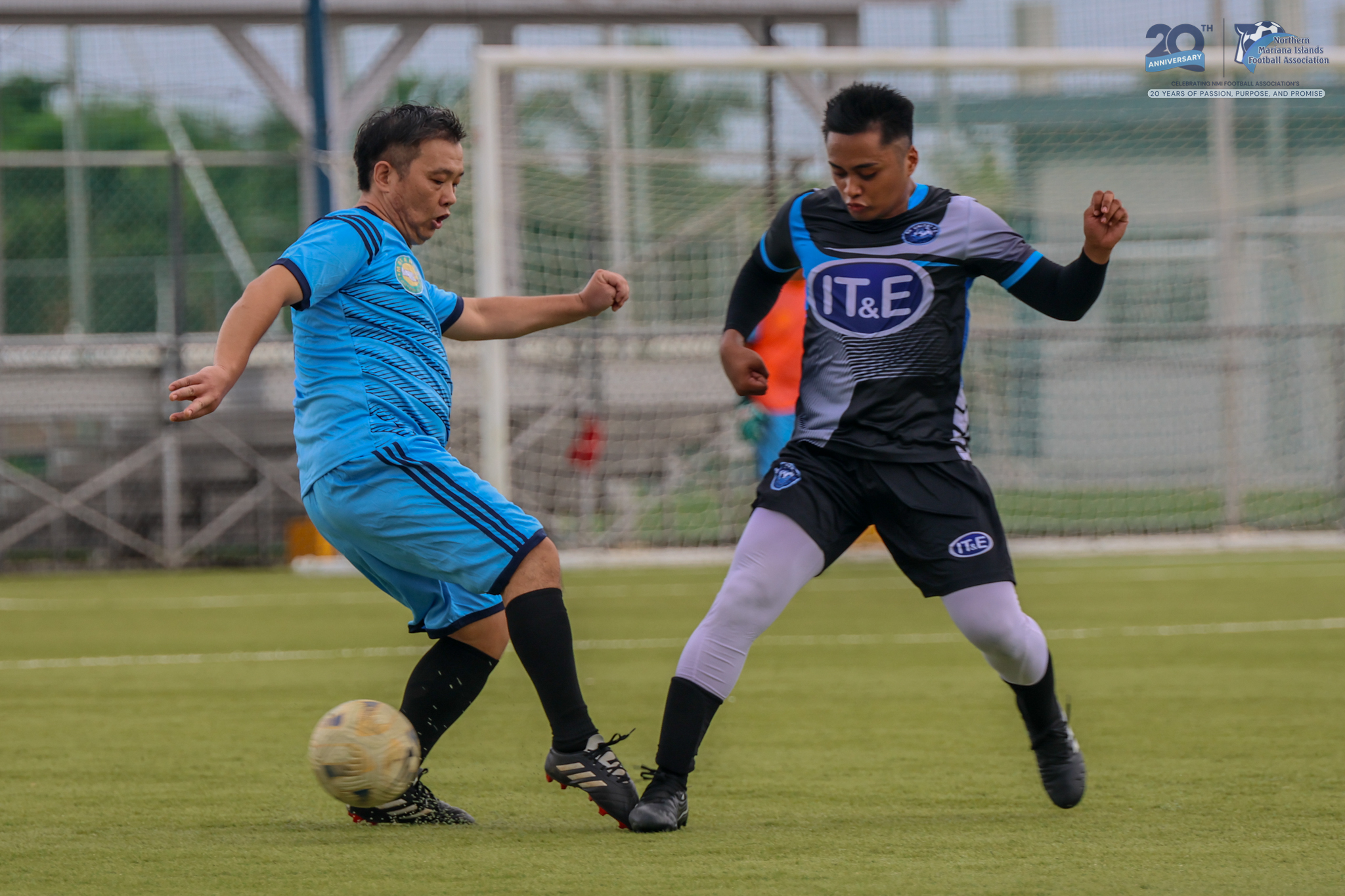 May be an image of 2 people, people playing football, people playing soccer and text