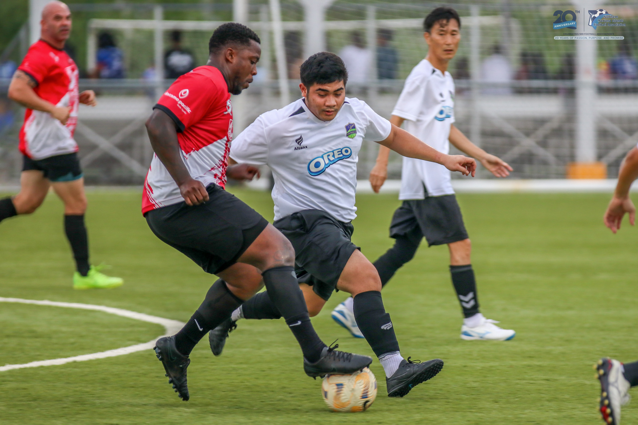 May be an image of 4 people, people playing football, people playing soccer and text