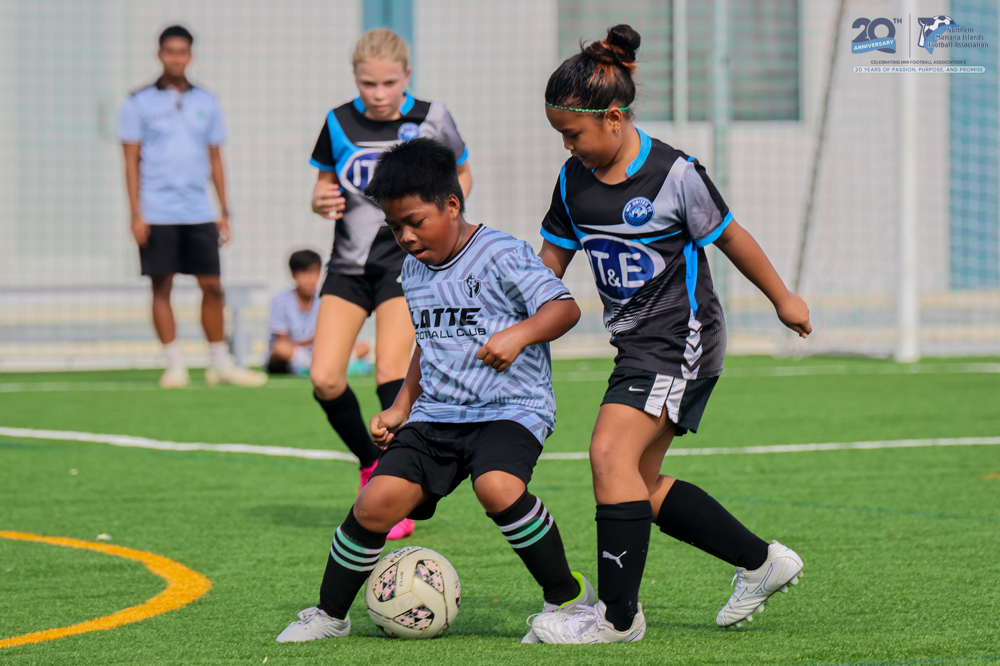 May be an image of 5 people, people playing football, people playing soccer and text