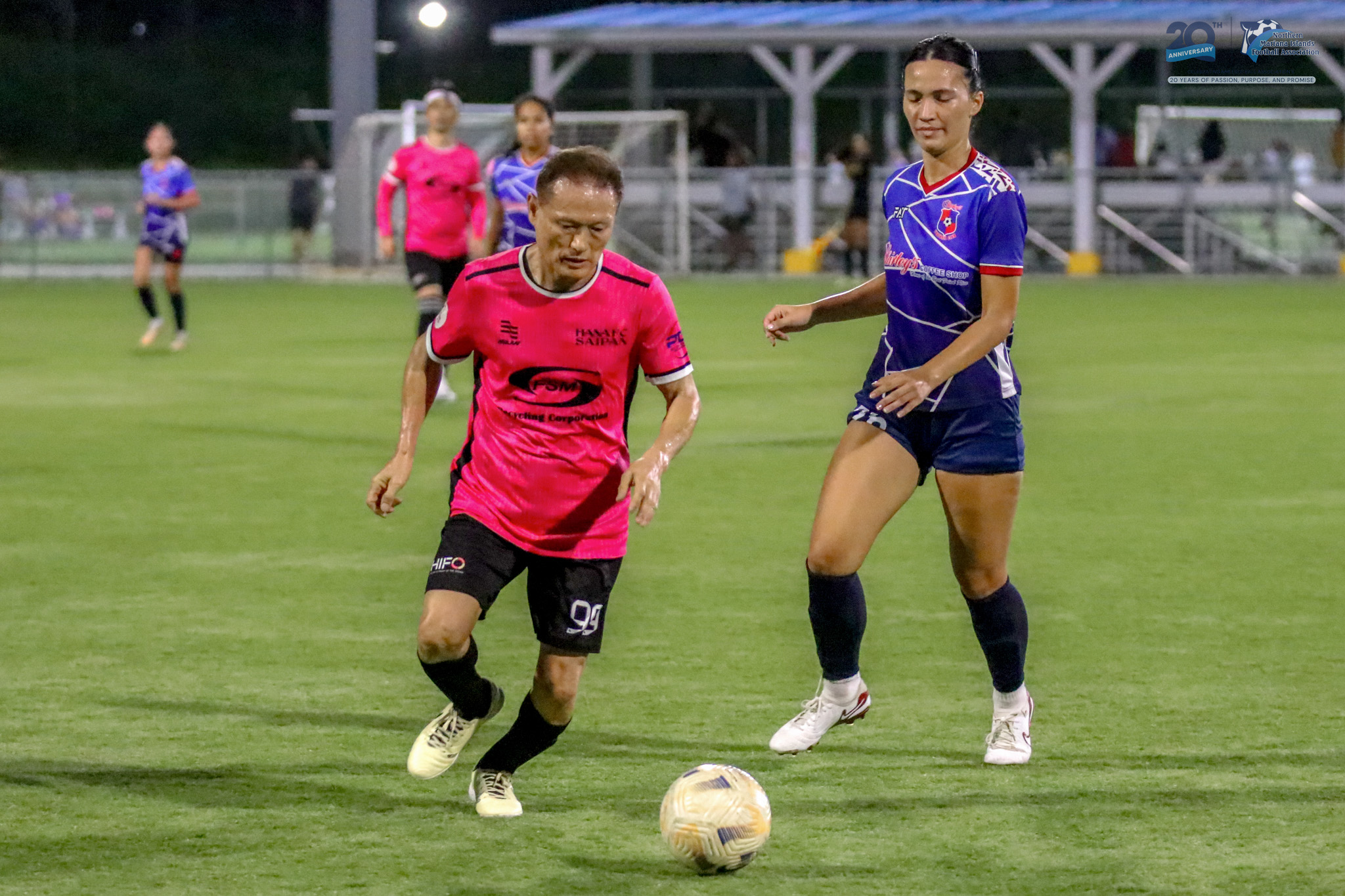 May be an image of 5 people, people playing football, people playing soccer and text