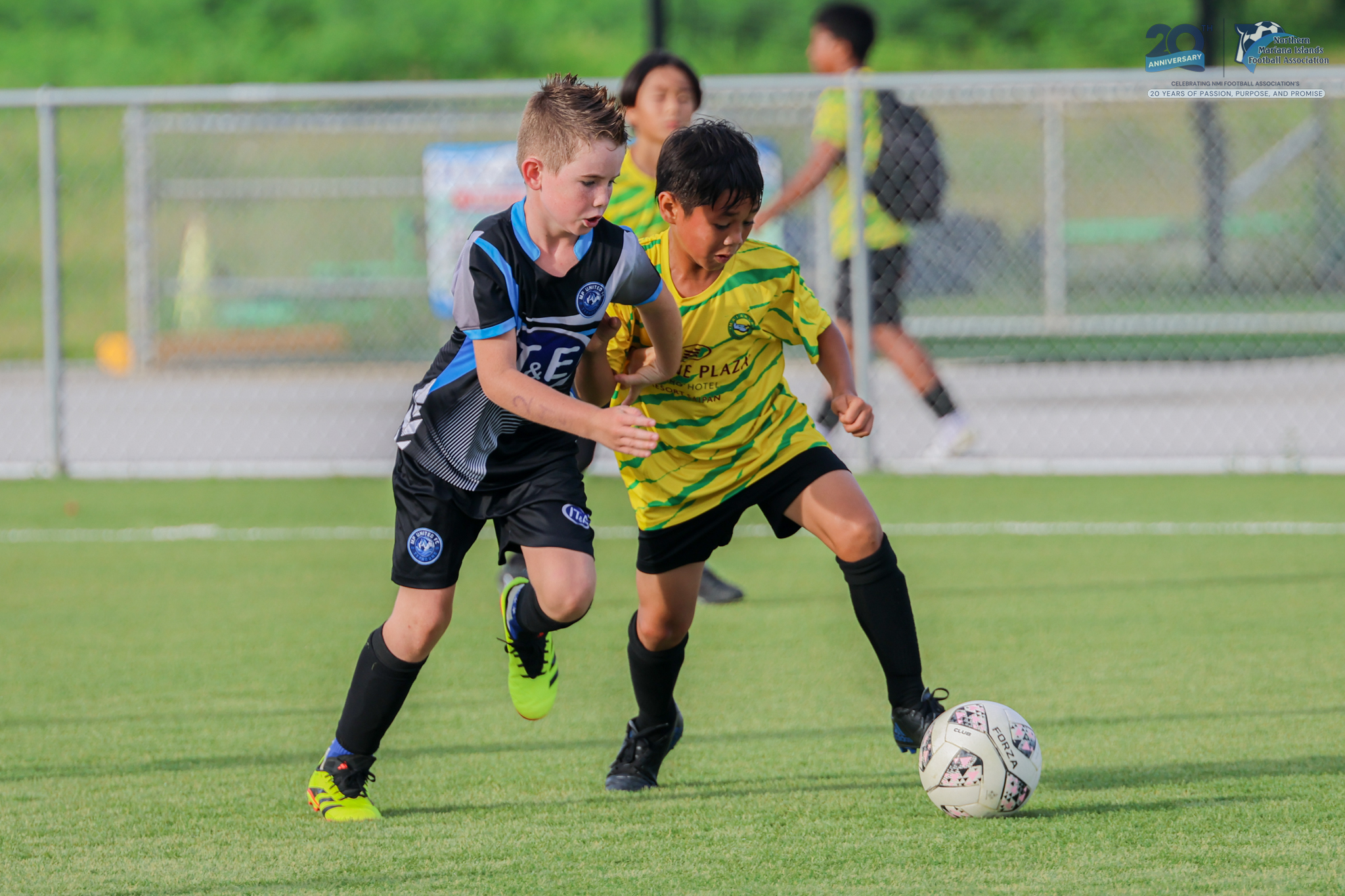 May be an image of 2 people, people playing football, people playing soccer and text