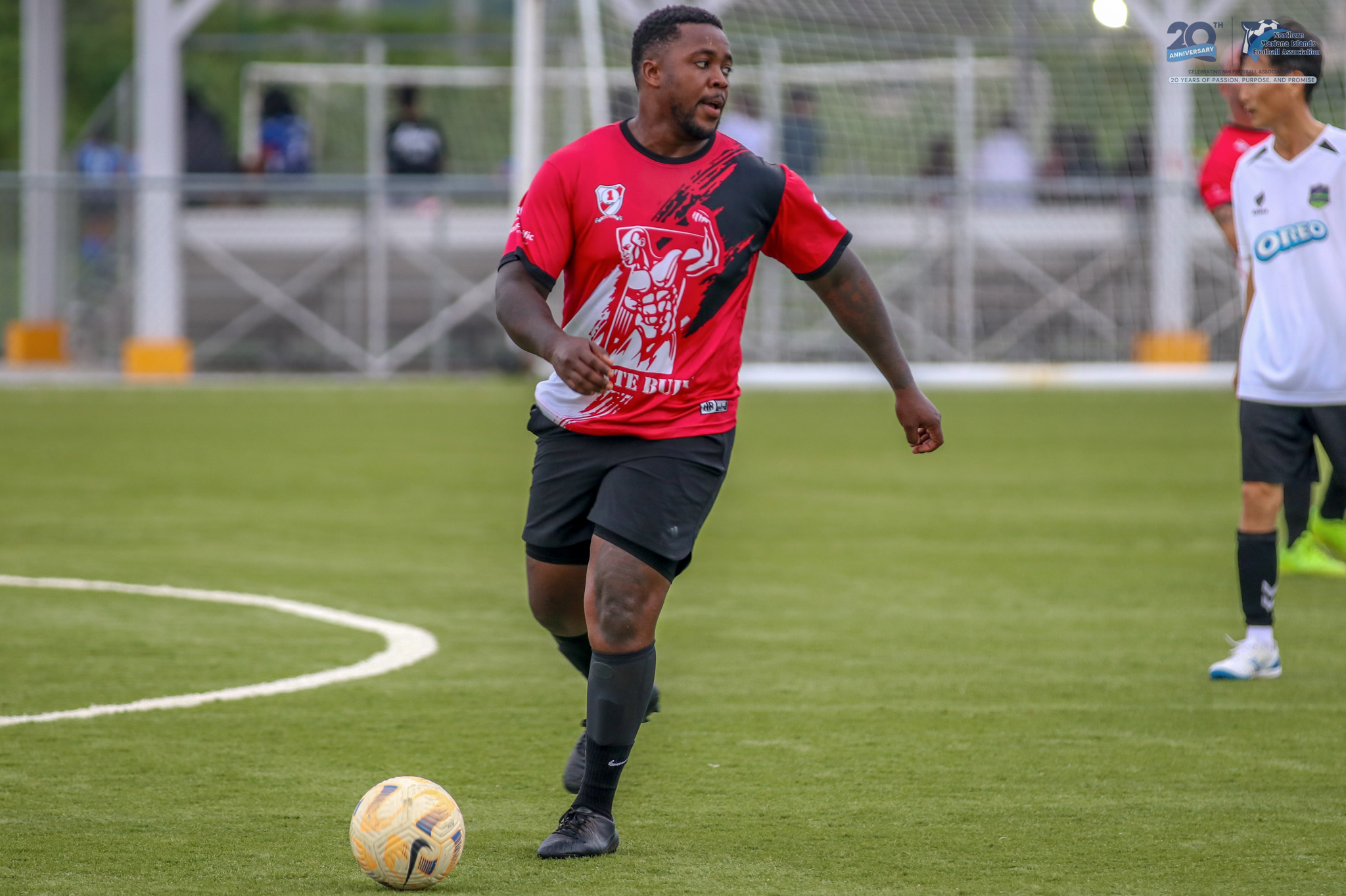 May be an image of 3 people, people playing soccer, people playing football and text