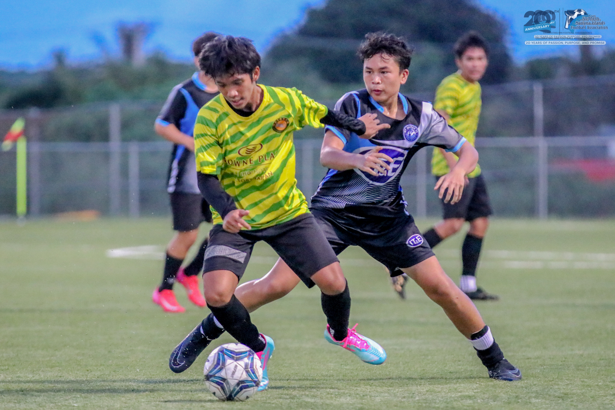 May be an image of 2 people, people playing football, people playing soccer and text