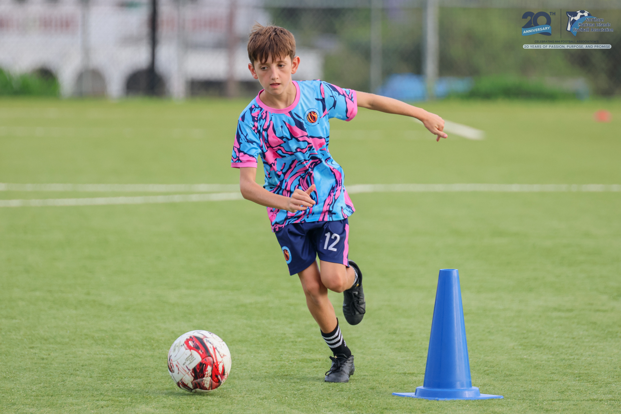 May be an image of 1 person, playing soccer, playing football and text