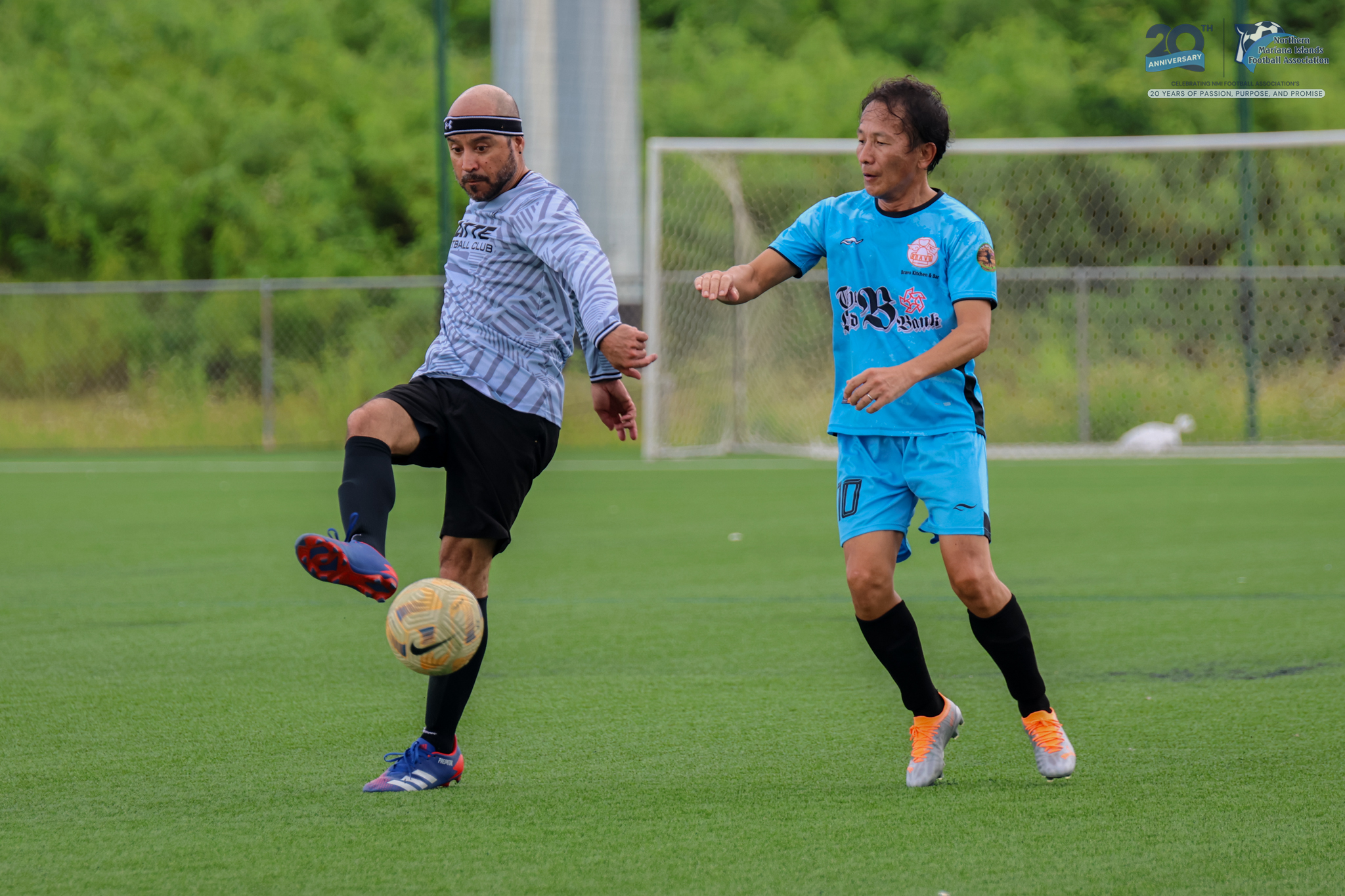 May be an image of 2 people, people playing football, people playing soccer and text