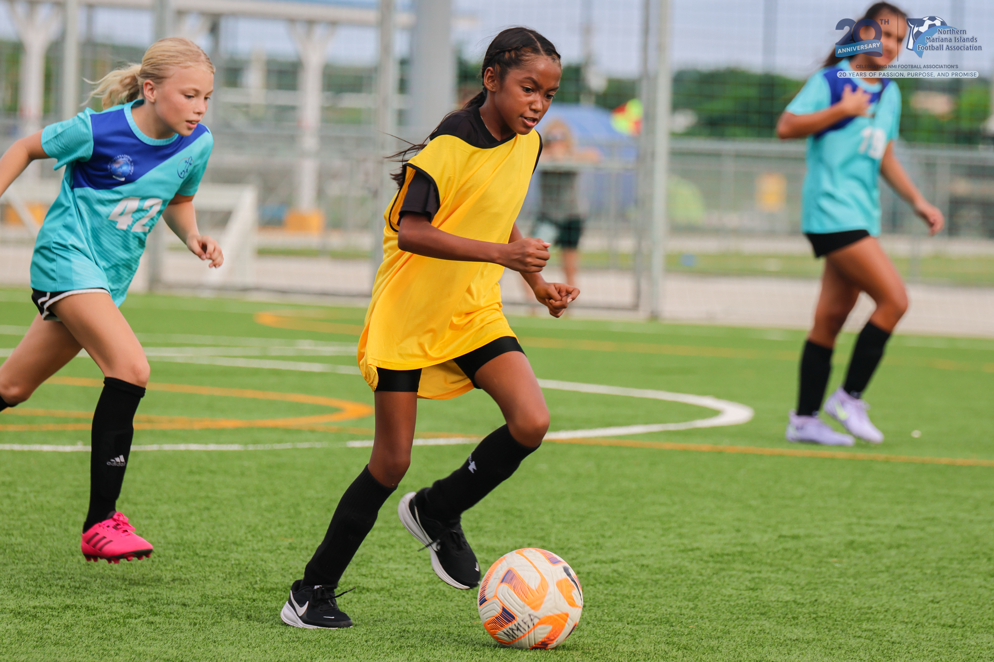 May be an image of 3 people, people playing soccer, people playing football and text