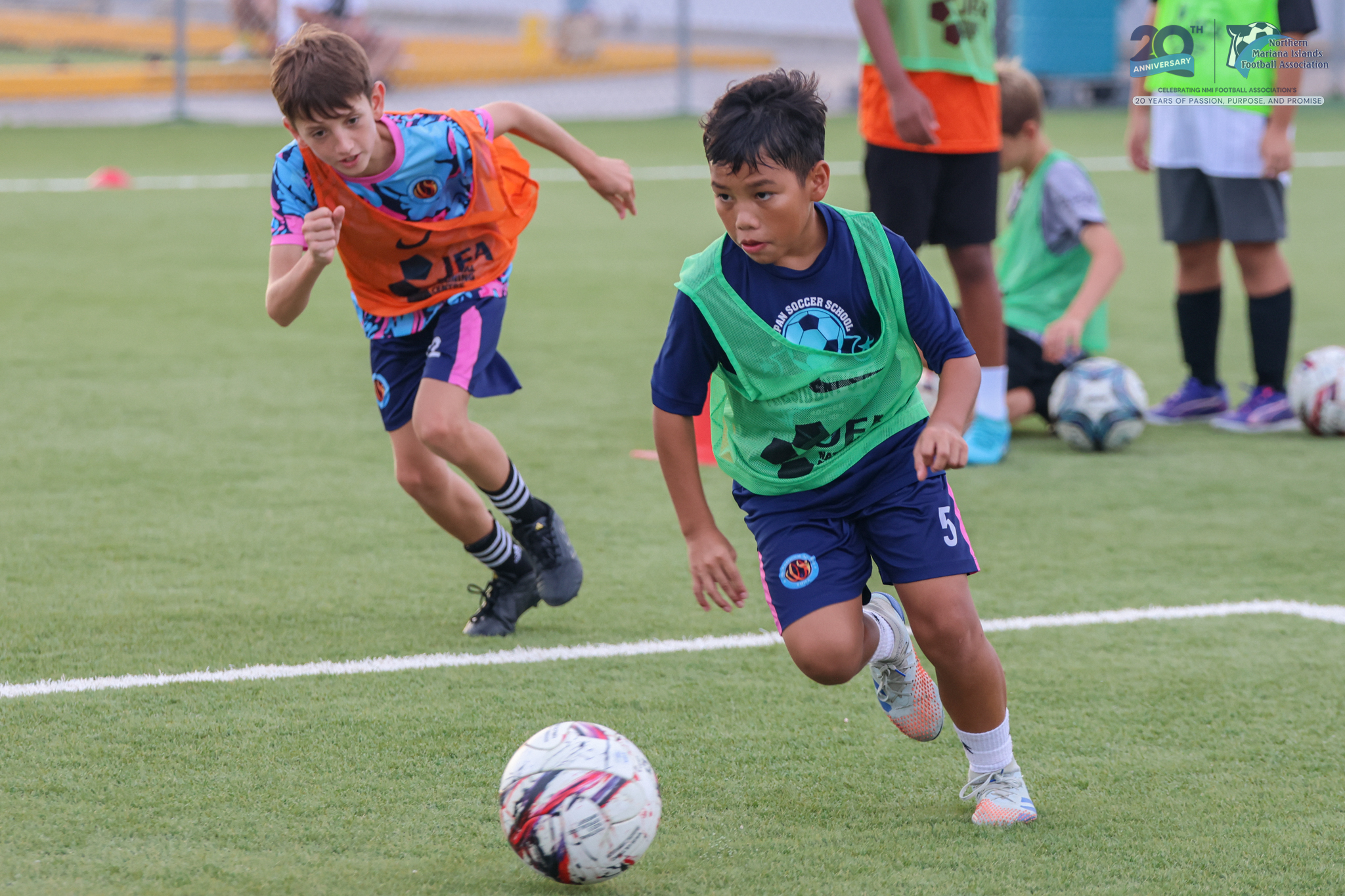 May be an image of 4 people, people playing football, people playing soccer and text
