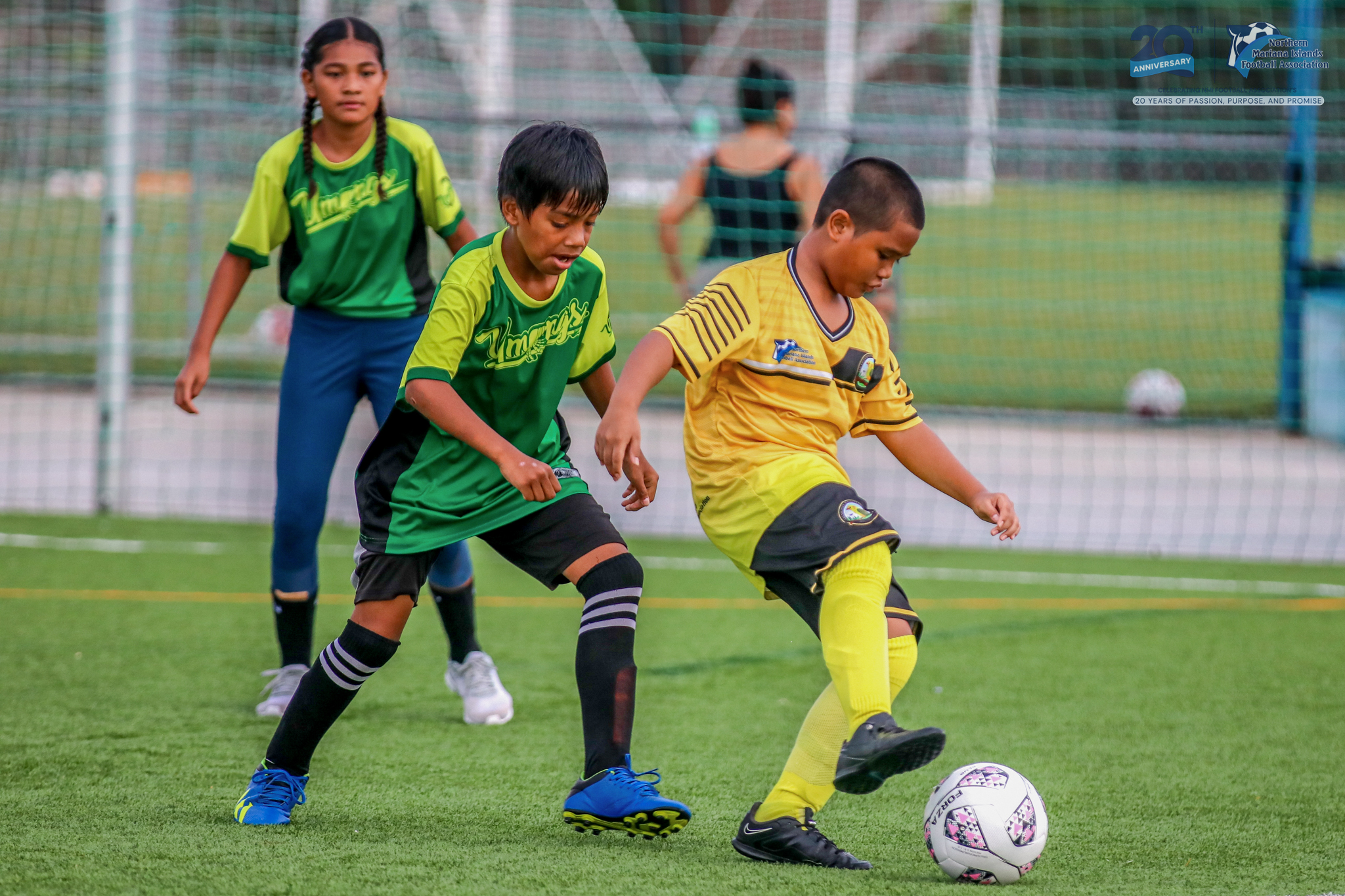 May be an image of 4 people, people playing football, people playing soccer and text