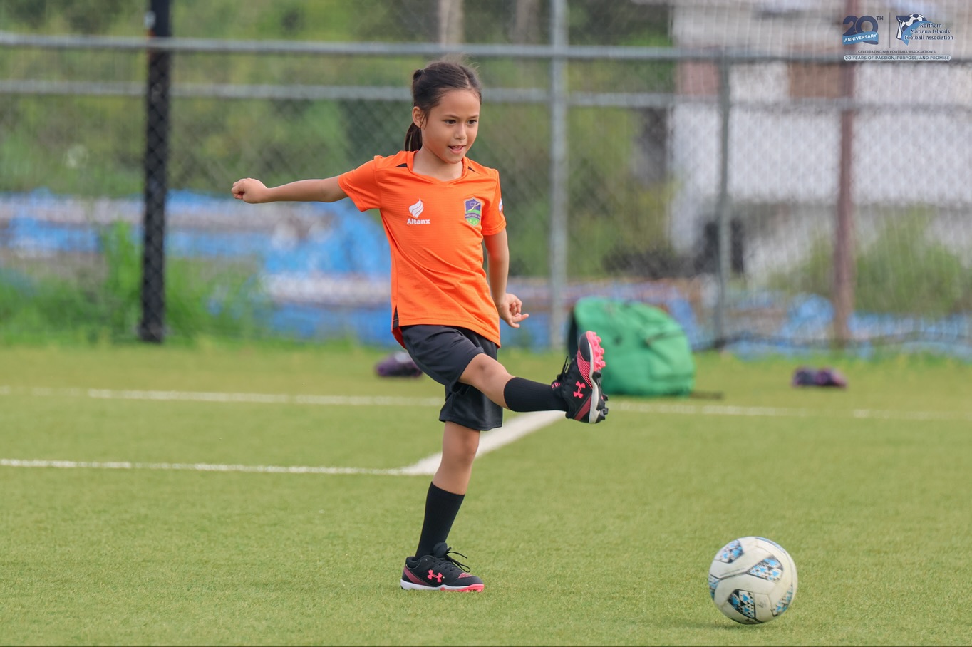 May be an image of 1 person, playing football, playing soccer and text