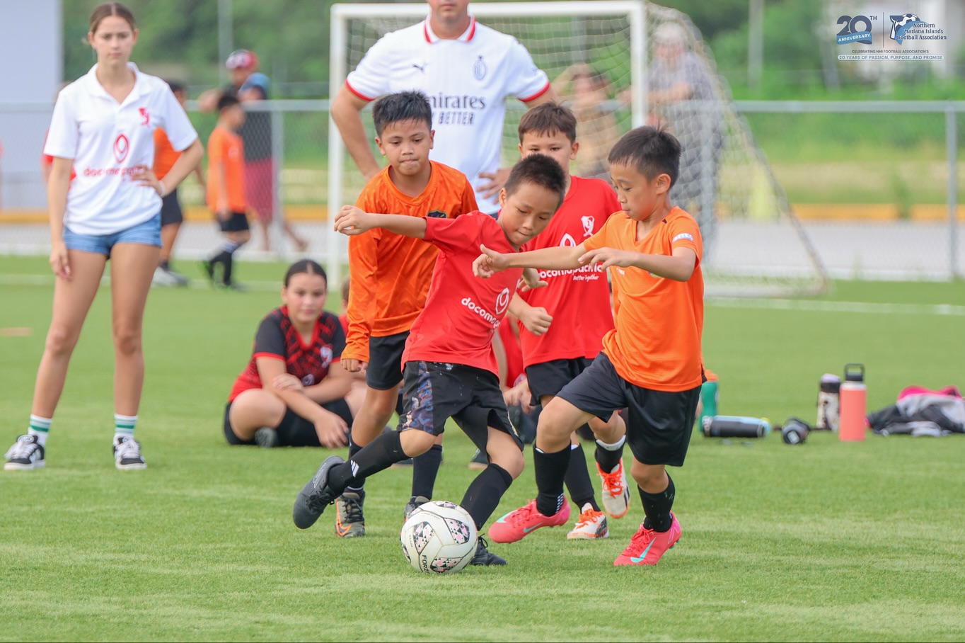 May be an image of 5 people, people playing soccer, people playing football and text