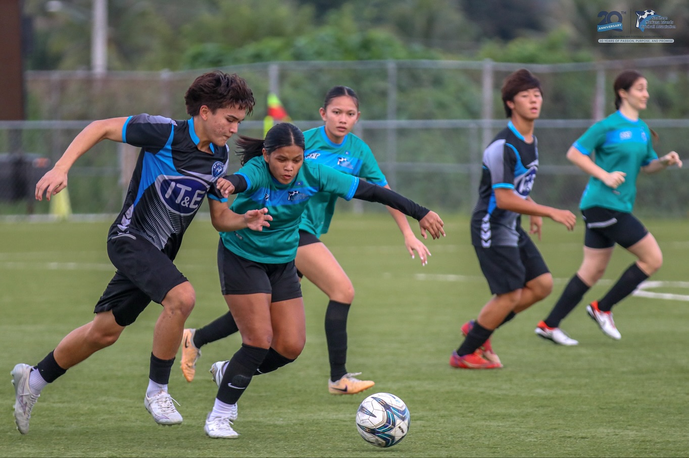May be an image of 5 people, people playing football, people playing soccer and text