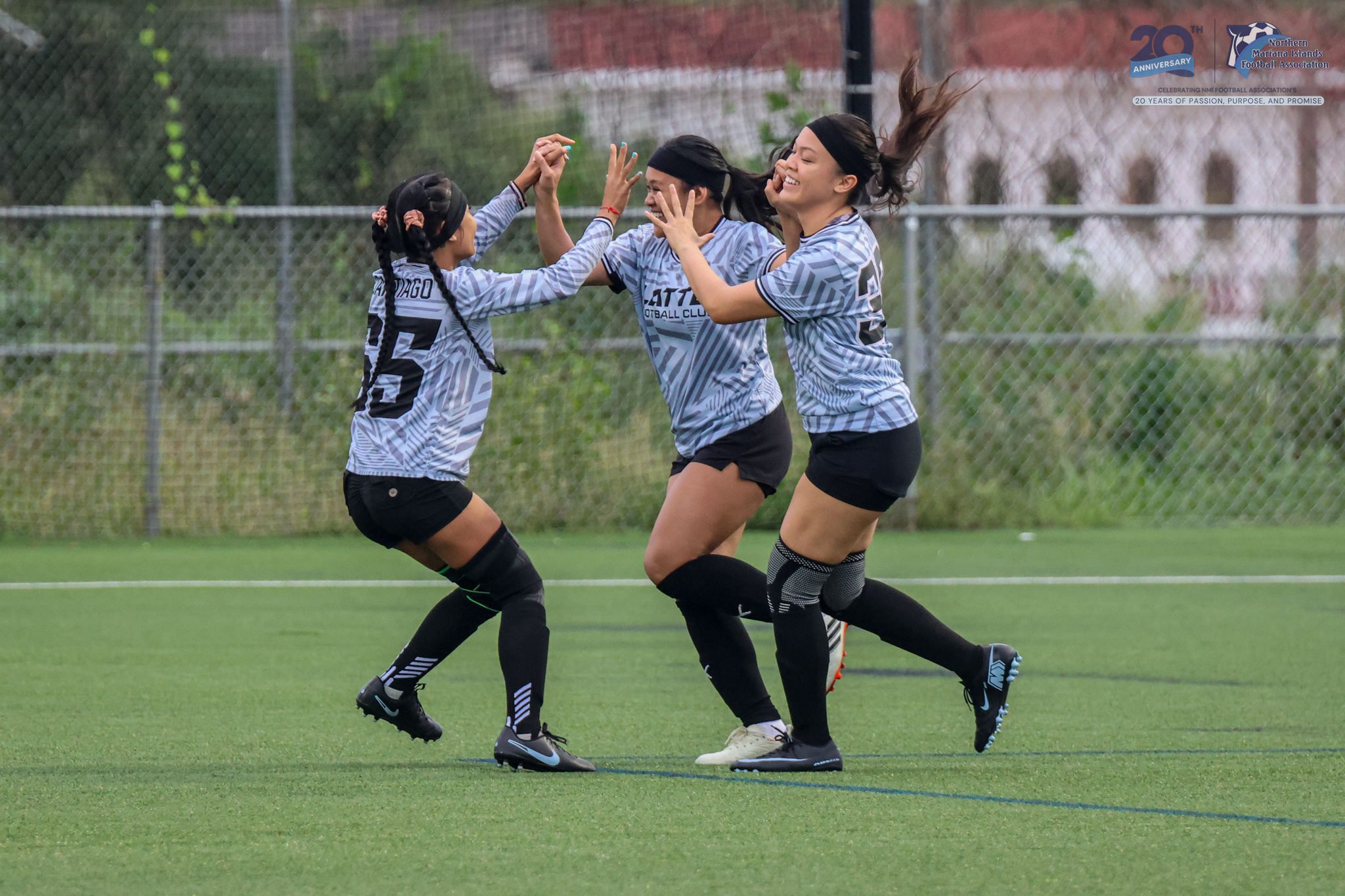 May be an image of 2 people, people playing football, people playing soccer and text