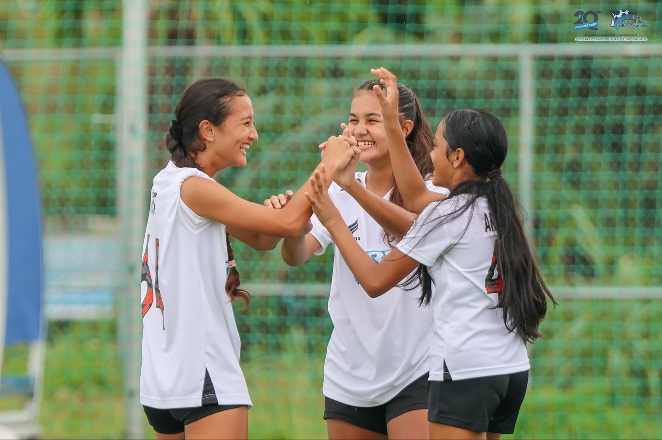 May be an image of 2 people, people playing football, people playing soccer and text