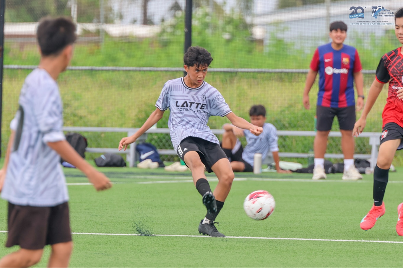 May be an image of 5 people, people playing soccer, people playing football and text