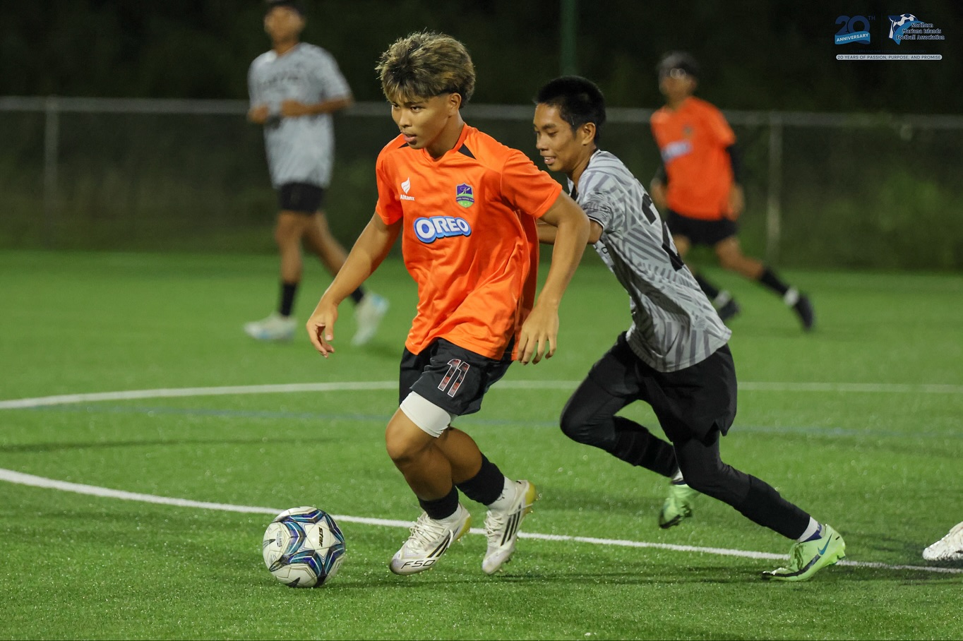 May be an image of 3 people, people playing soccer, people playing football and text
