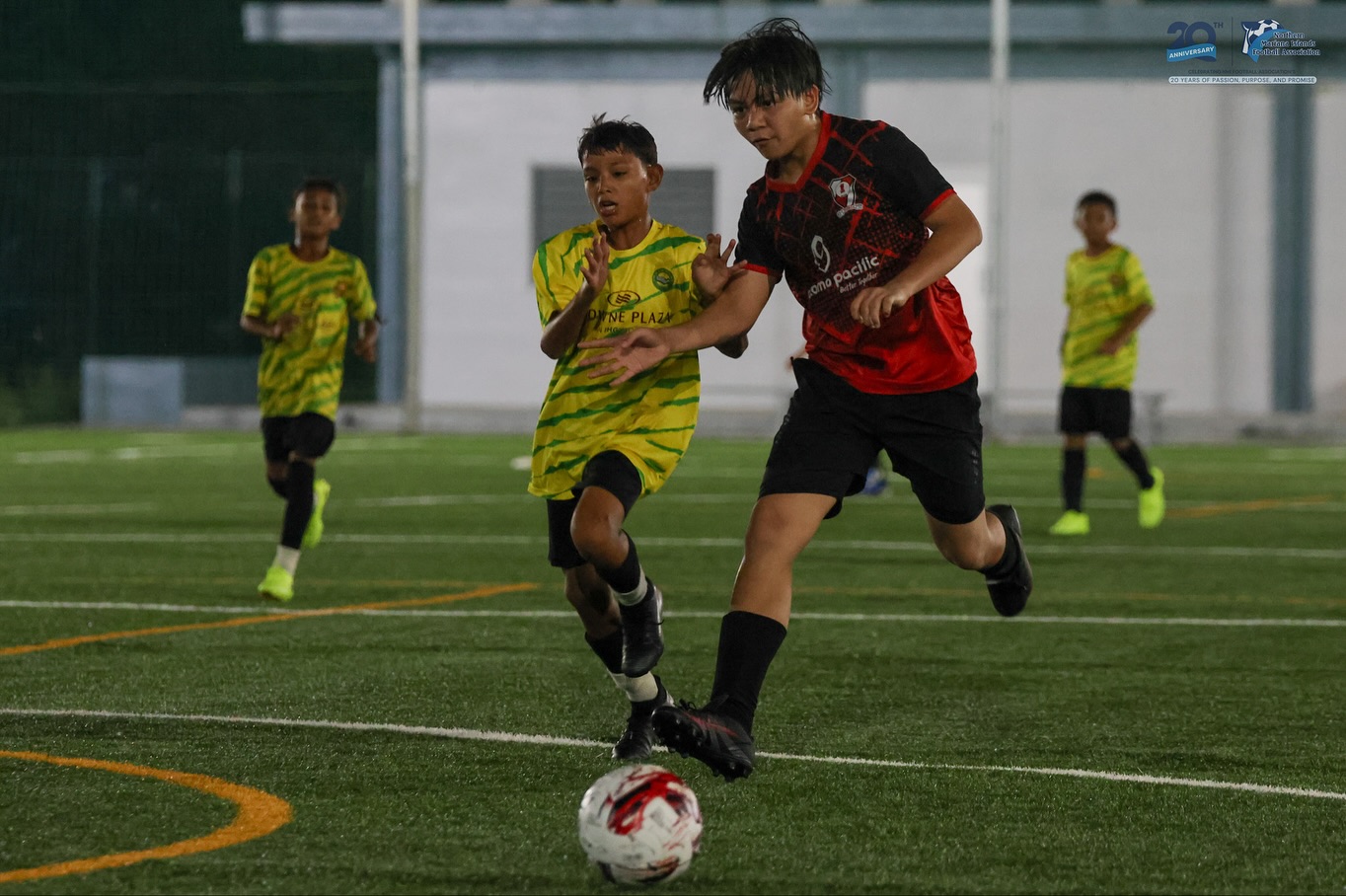 May be an image of 4 people, people playing football, people playing soccer and text