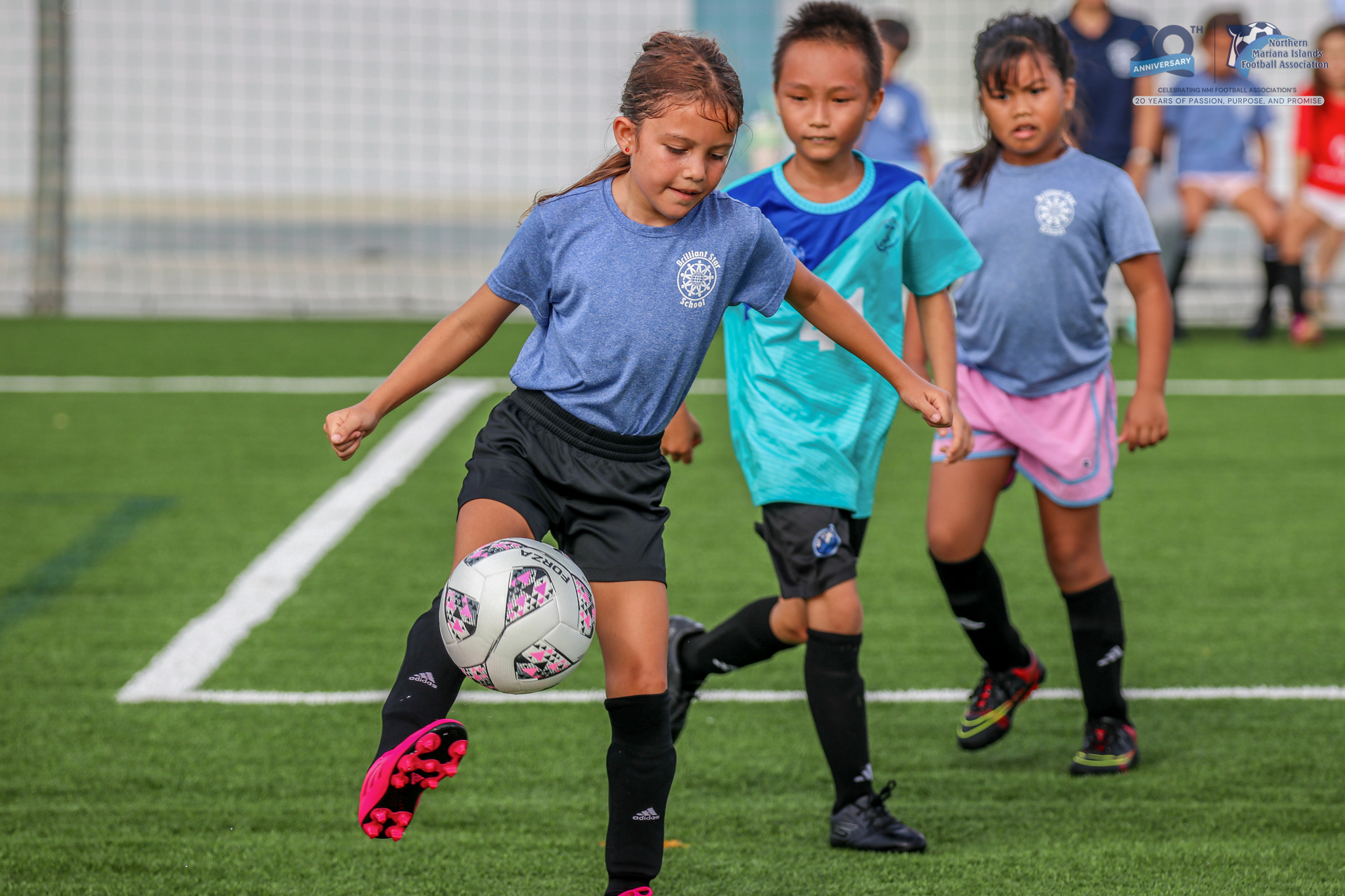 May be an image of 4 people, people playing soccer, people playing football and text