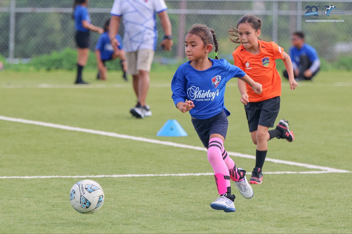 May be an image of 5 people, people playing football and people playing soccer