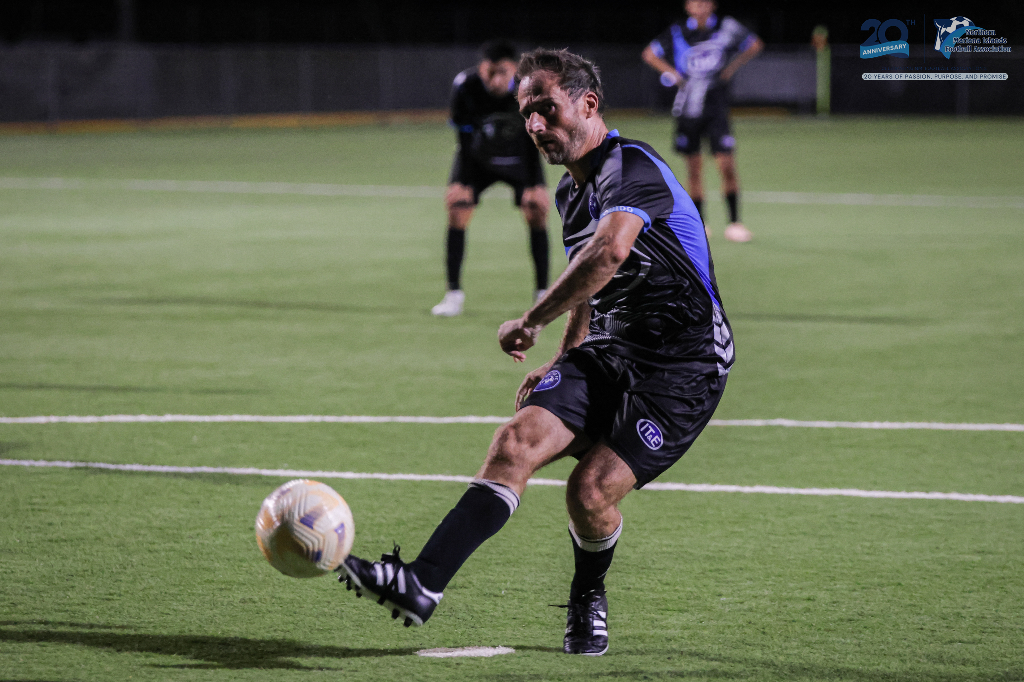 May be an image of 3 people, people playing football, people playing soccer and text