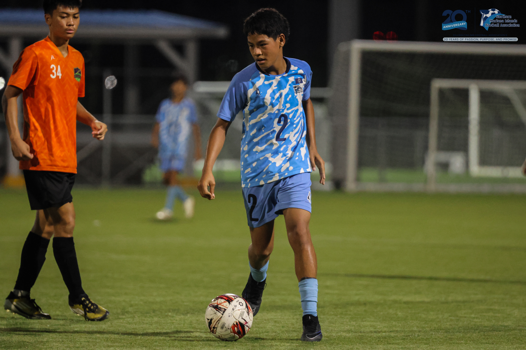 May be an image of 3 people, people playing football, people playing soccer and text