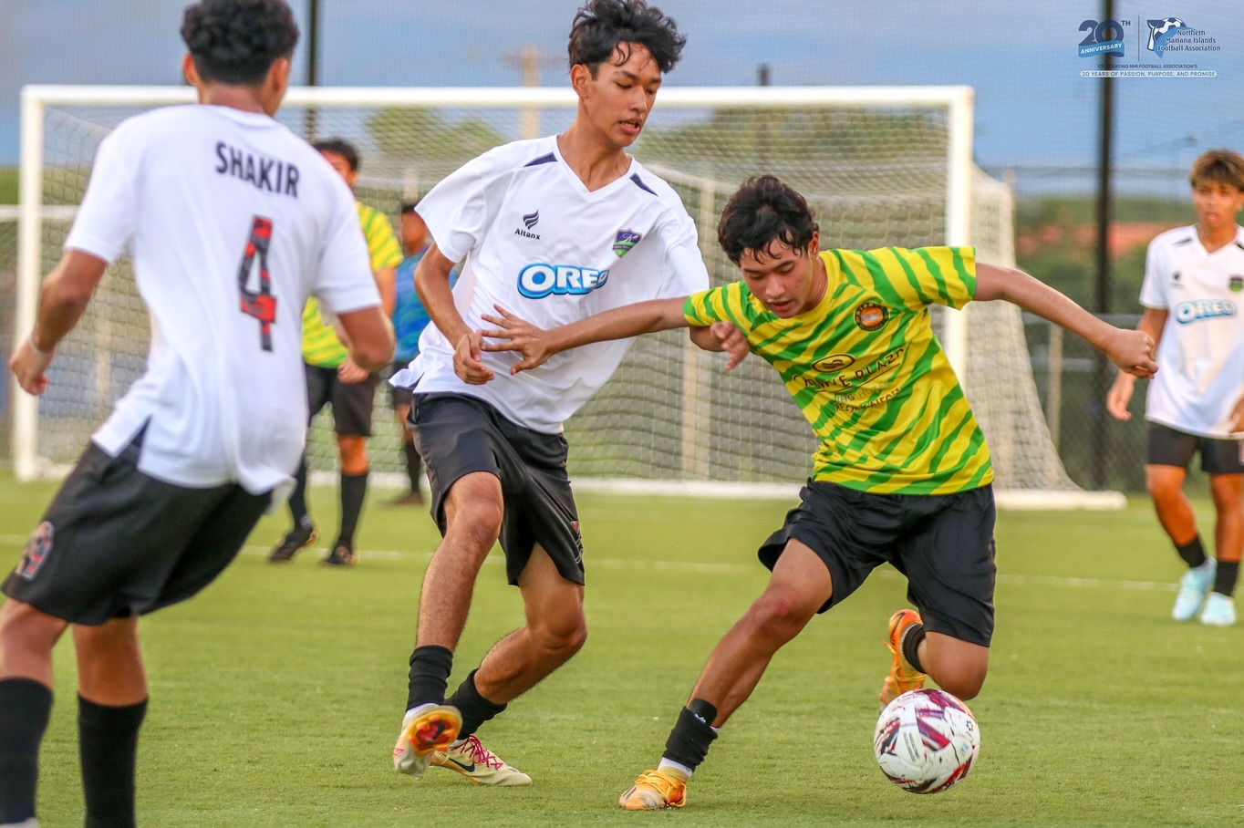 May be an image of 4 people, people playing football, people playing soccer and text