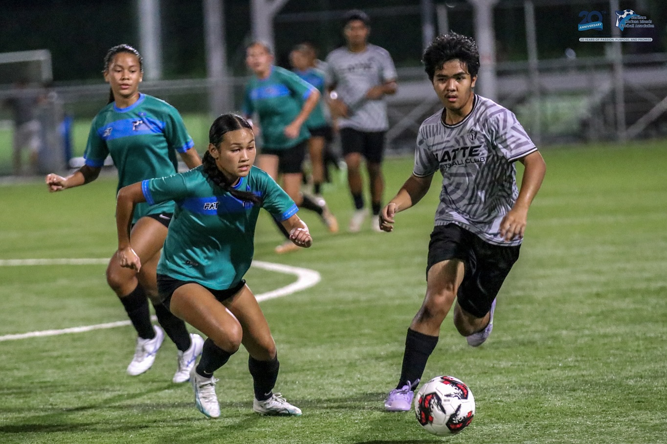 May be an image of 5 people, people playing football, people playing soccer and text